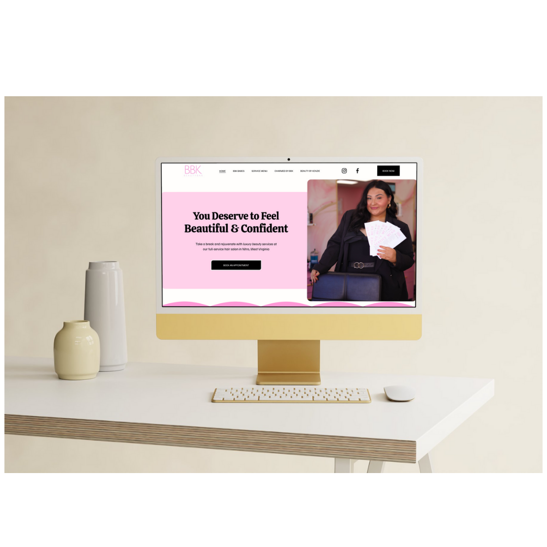 Computer screen displaying a beauty salon website with a woman holding multiple tickets, pink and white color scheme, on a white desk with two decorative vases.