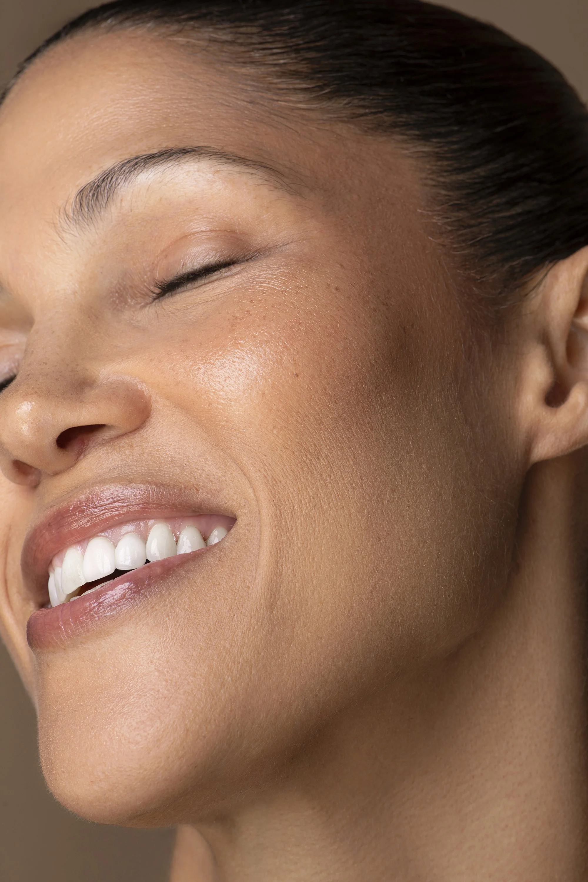  Commercial facial and skincare advertising portrait for AYA Skin photographed in Atlanta by Caitlin Tabilog, featuring a Forward The Agency model with natural-looking complexion, polished makeup by Danielle Onesto, and hair by Jules Thomas. 