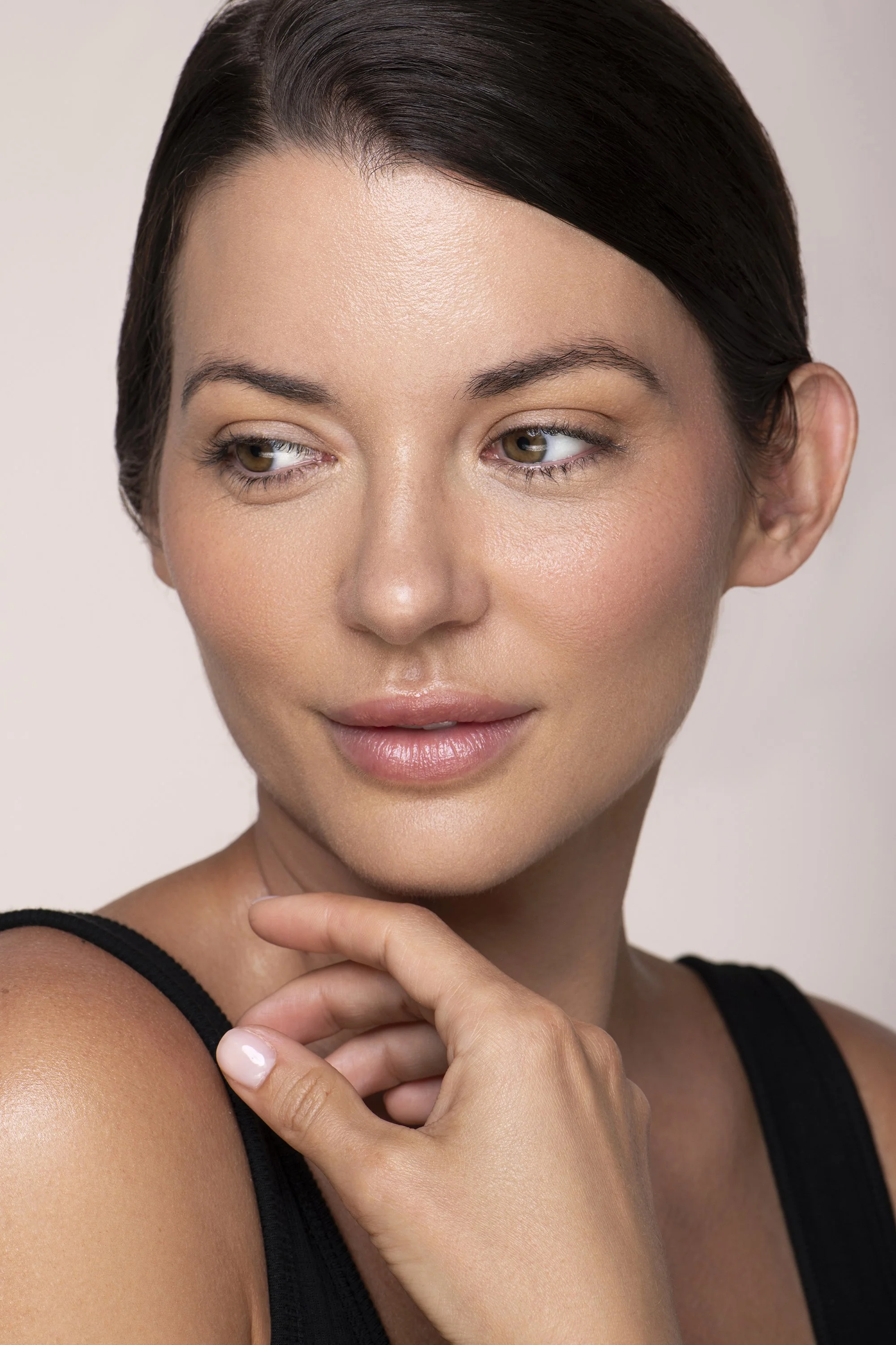  Commercial beauty photography in Atlanta for AYA Skin featuring a professional female model with fresh, natural-looking skin, photographed by Caitlin Tabilog for skincare, cosmetics, Botox, facial, and aesthetic treatment advertising. 