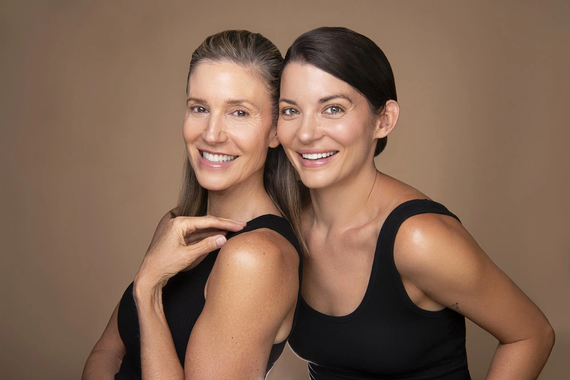  Atlanta commercial portrait photographer Caitlin Tabilog photographs a Forward The Agency model for AYA Skin’s skincare and medical spa campaign, featuring clean studio lighting, natural skin texture, professional makeup, and a neutral beige backgro