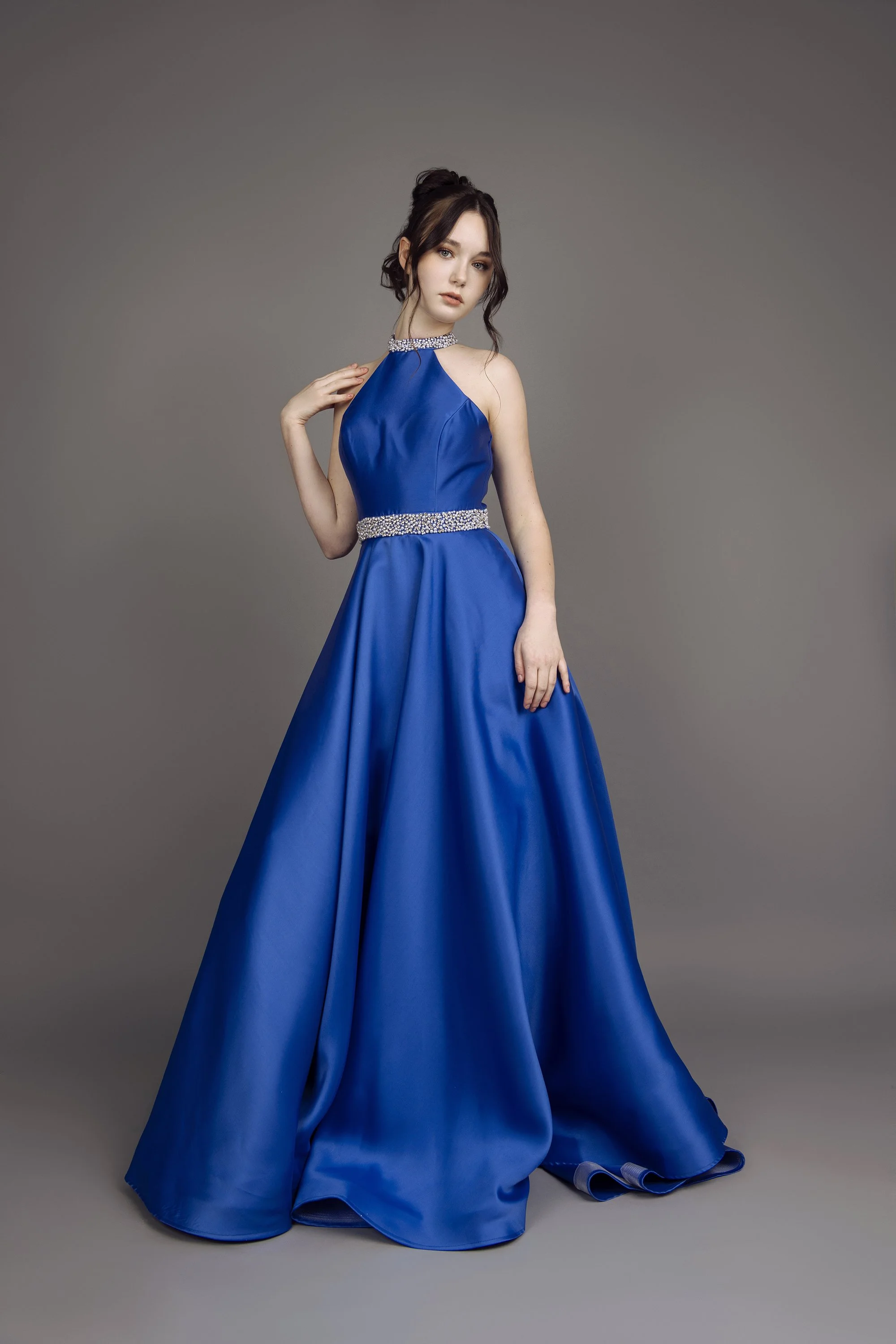 Atlanta beauty and fashion photographer Caitlin Tabilog studio portrait of model from Forward the Agency wearing formal dress from Twin Hearts Formal Canton GA with editorial lighting