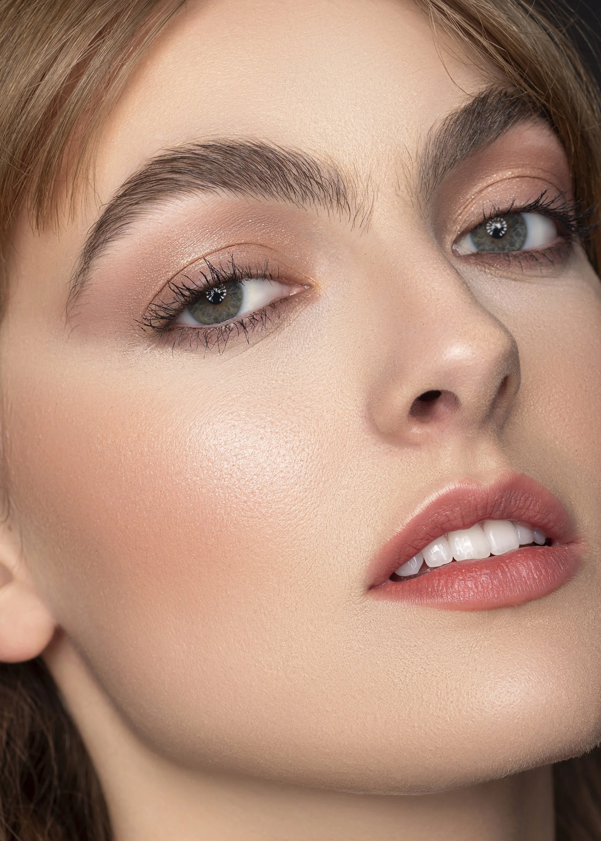 Editorial beauty photography of a Forward The Agency model captured at Industry Makeup Academy in Atlanta, Georgia. High-end studio portrait against a black backdrop showcasing professional makeup artistry, clean beauty lighting, and striking facial 