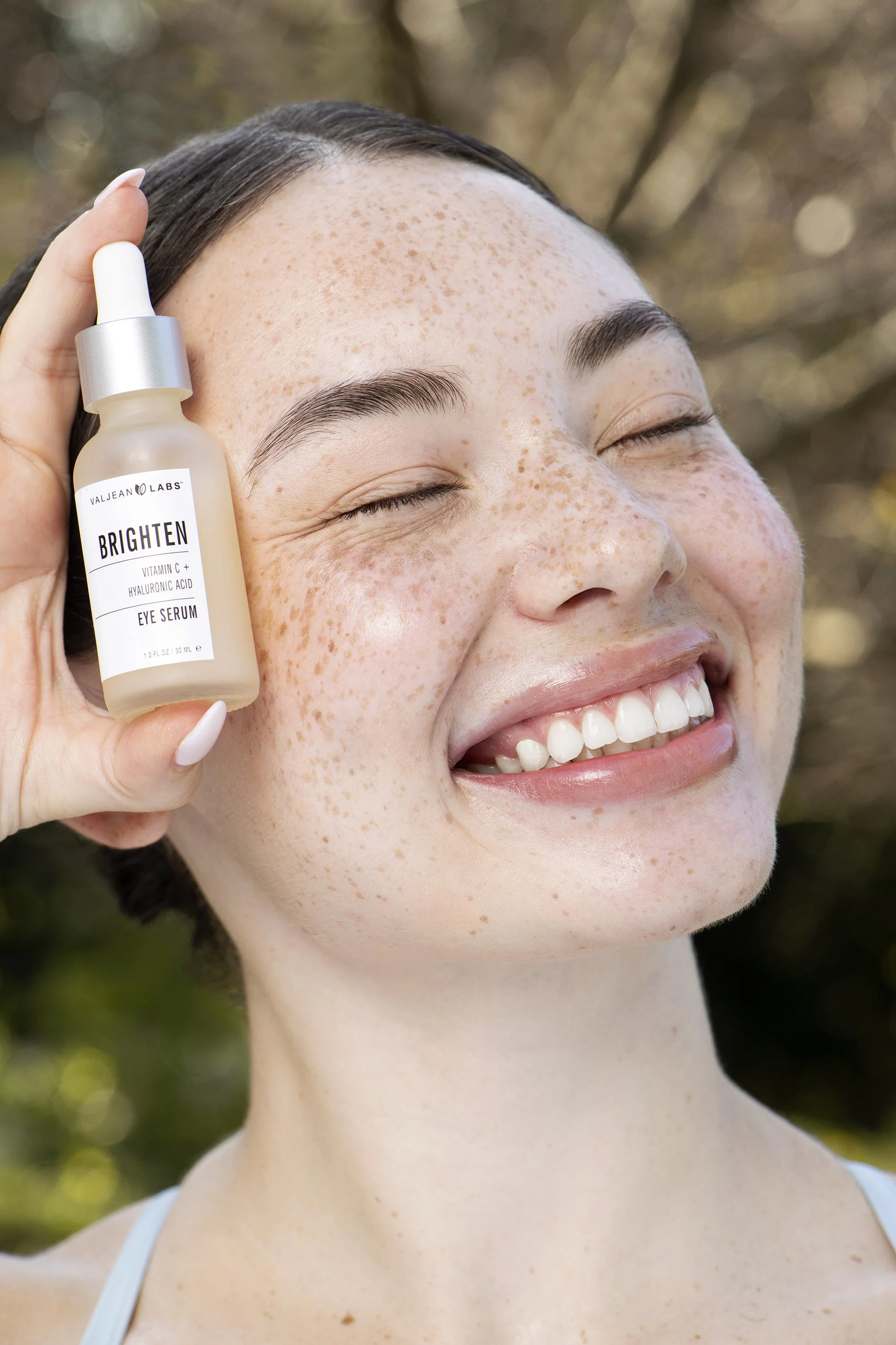 Outdoor commercial beauty photography in Atlanta, Georgia featuring Forward The Agency model Olivia with vibrant makeup, natural skin texture, colorful styling, and bright summer light for a beauty campaign.