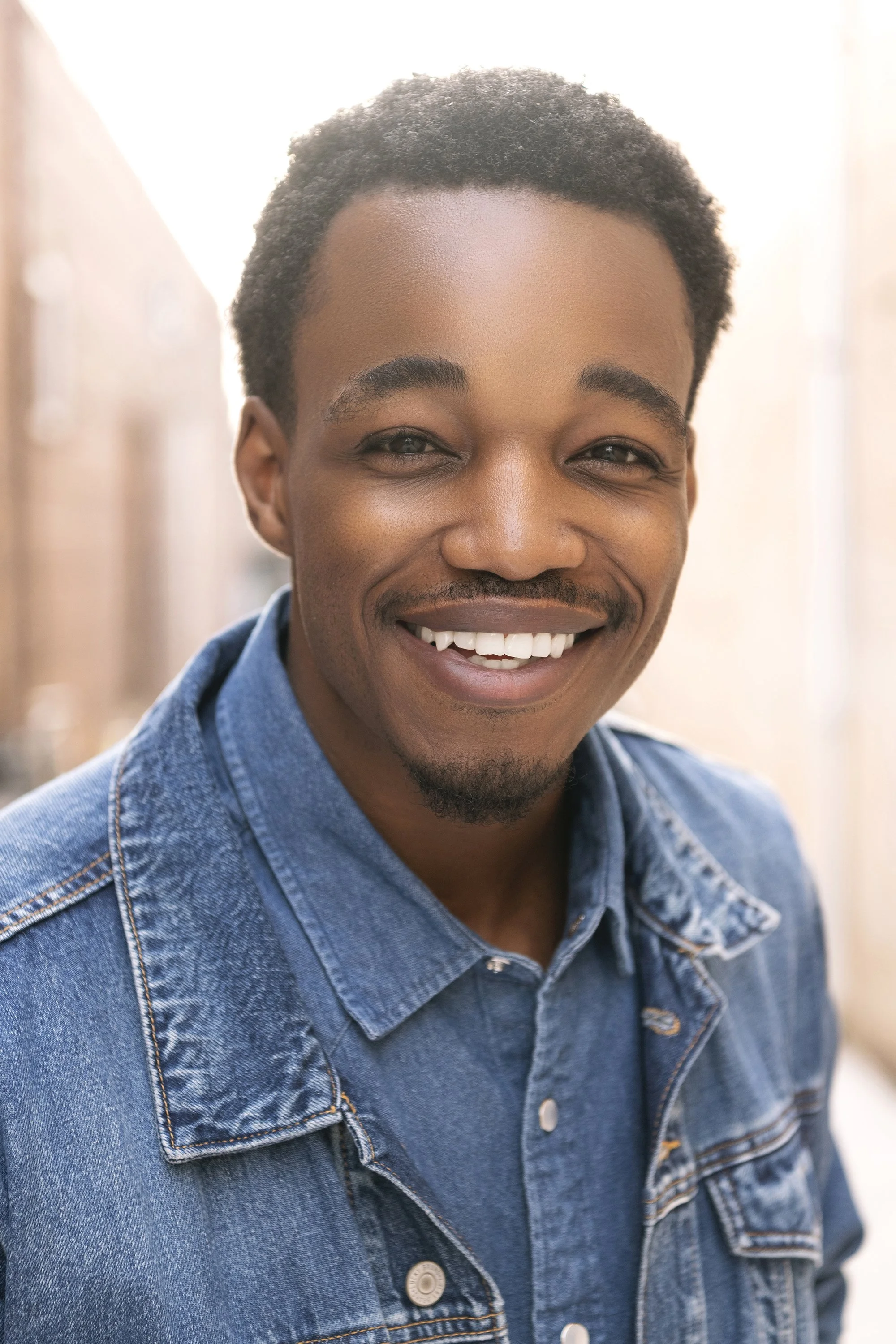 Atlanta beauty and lifestyle photographer Caitlin Tabilog editorial outdoor portrait of Julian Green model actor with natural lighting vibrant colors and men’s fashion styling downtown Marietta Georgia