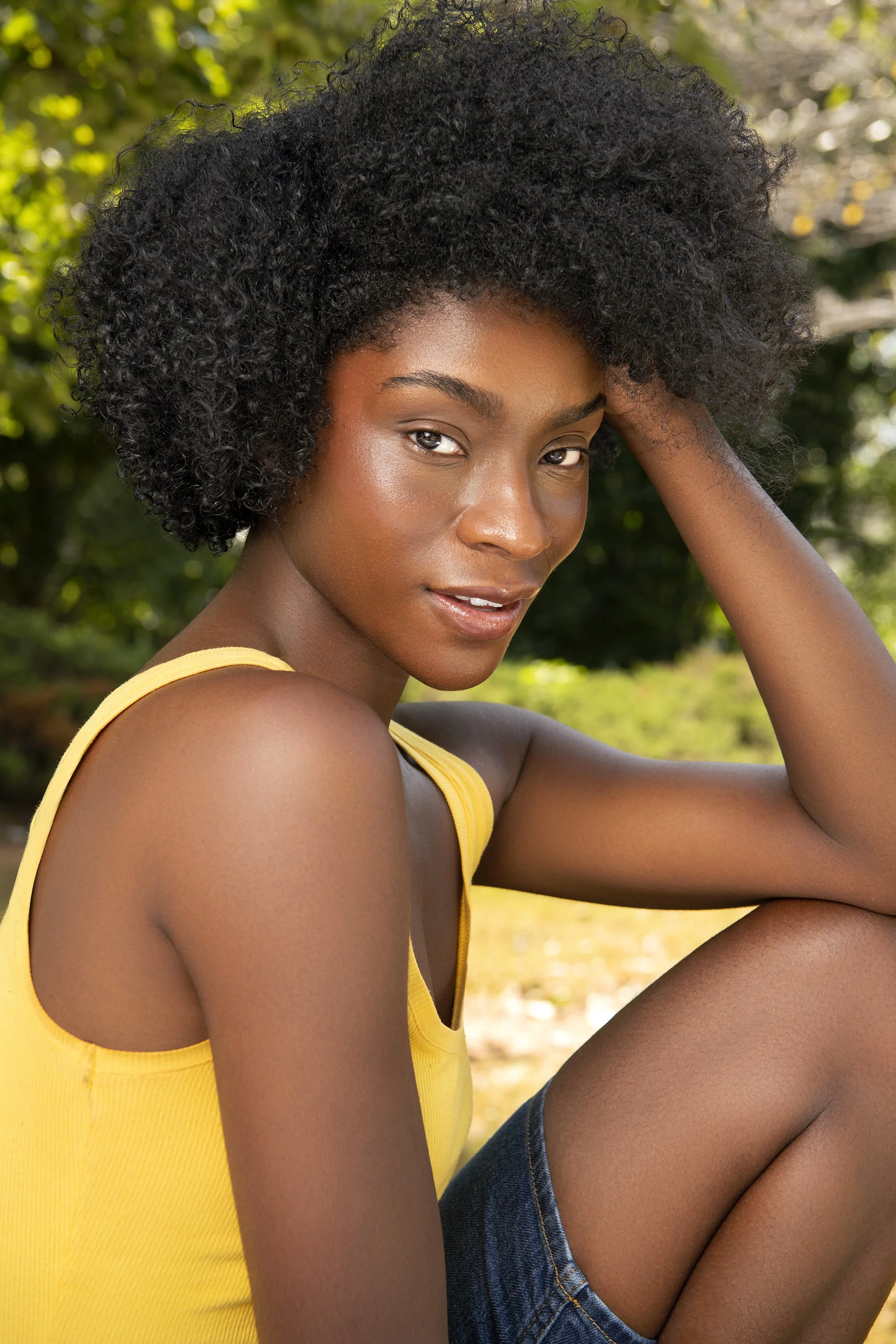 Atlanta fashion and beauty photographer Caitlin Tabilog photographs Forward The Agency model Gracie in a playful summer beauty portrait featuring vibrant colors, natural sunlight, professional makeup, and editorial styling.