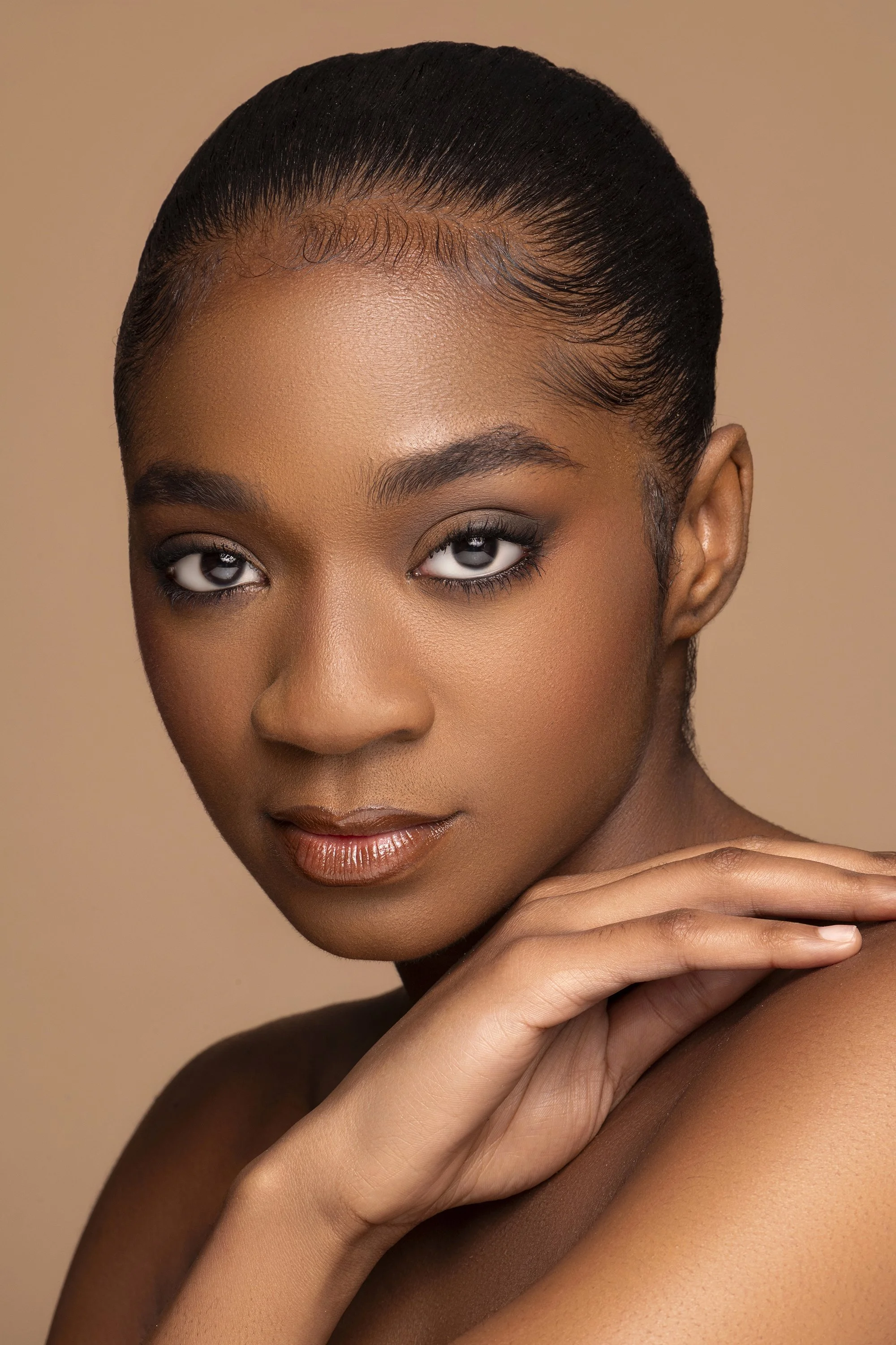 High-end beauty portrait of Audrey, represented by Click Models Atlanta, photographed for Industry Makeup Academy in Atlanta, Georgia. Studio beauty photography highlighting flawless makeup application, radiant skin, and editorial lighting by Caitlin
