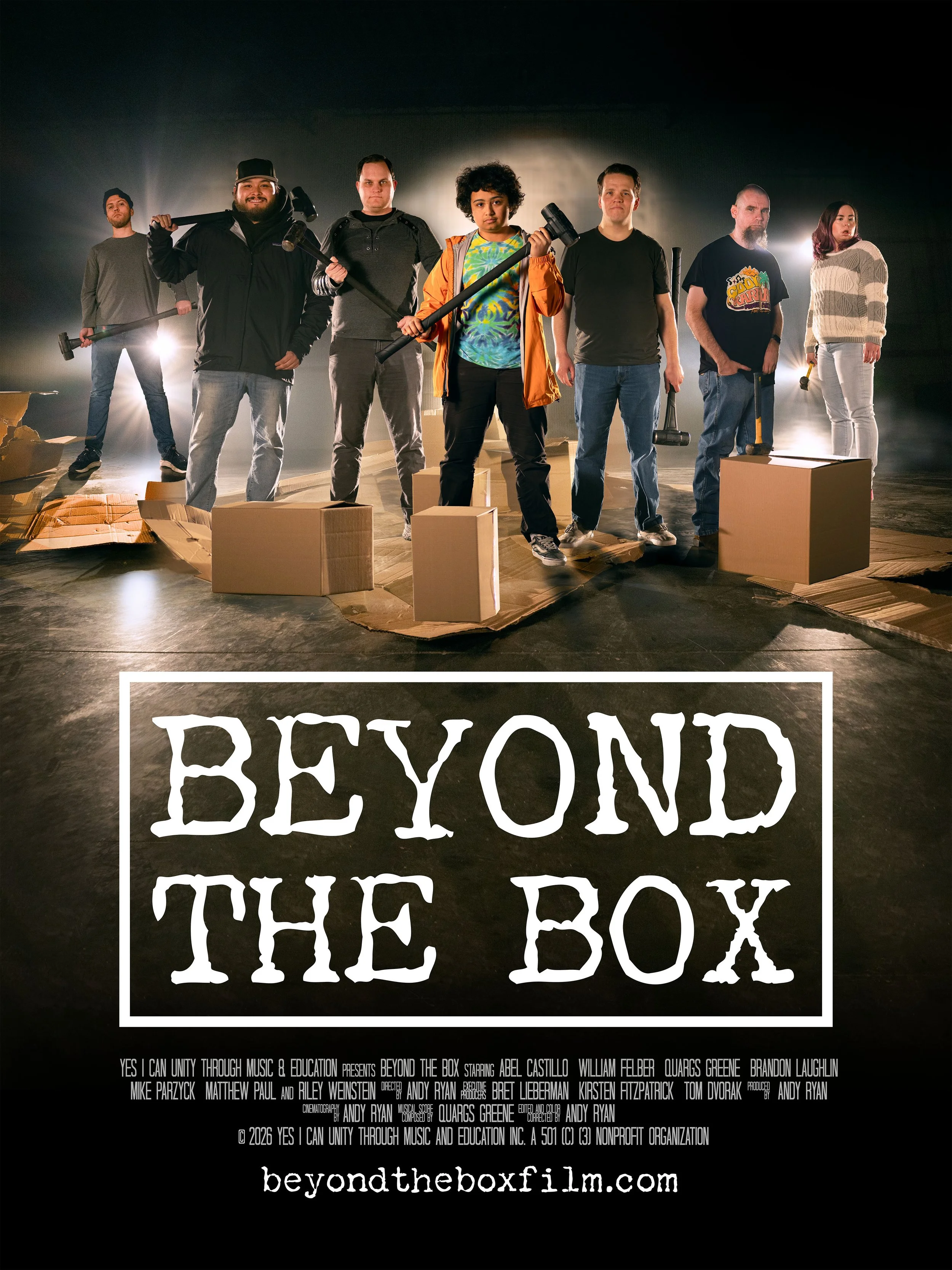 Poster for the documentary film 'Beyond the Box: The Box,' showing seven diverse individuals standing on a stage with cardboard boxes in front of them, holding hammers, with the title prominently displayed.