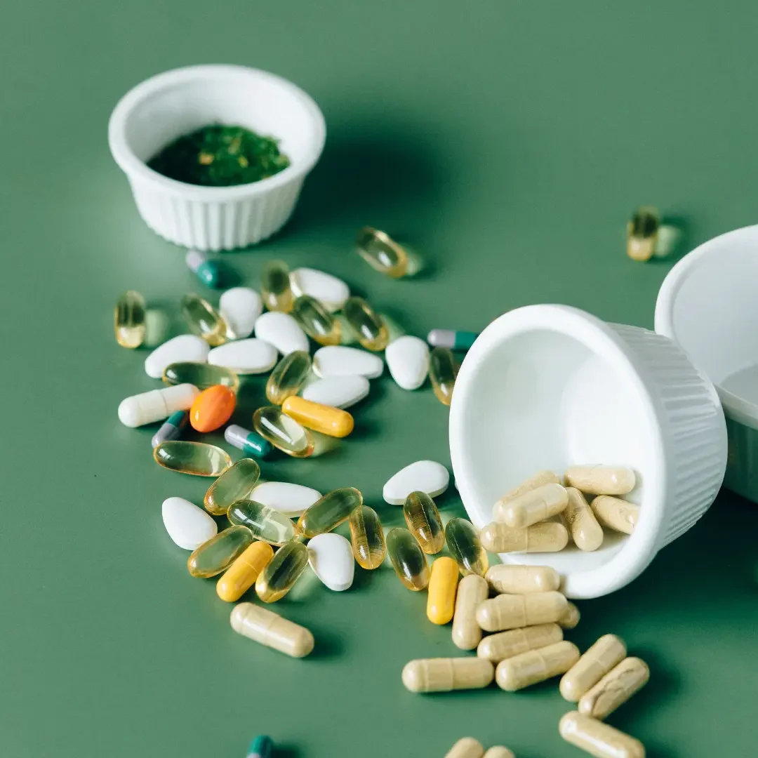 A variety of supplements on a green background