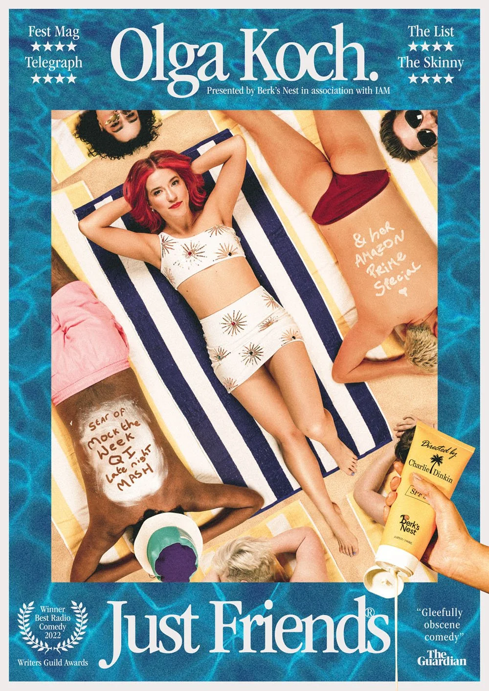 A group of young women lying on beach towels at the poolside, with one woman in a white outfit with a starburst pattern at the center. One woman has red hair, and another has writing on her back. A hand holding a bottle of sunscreen labeled 'Derk's N