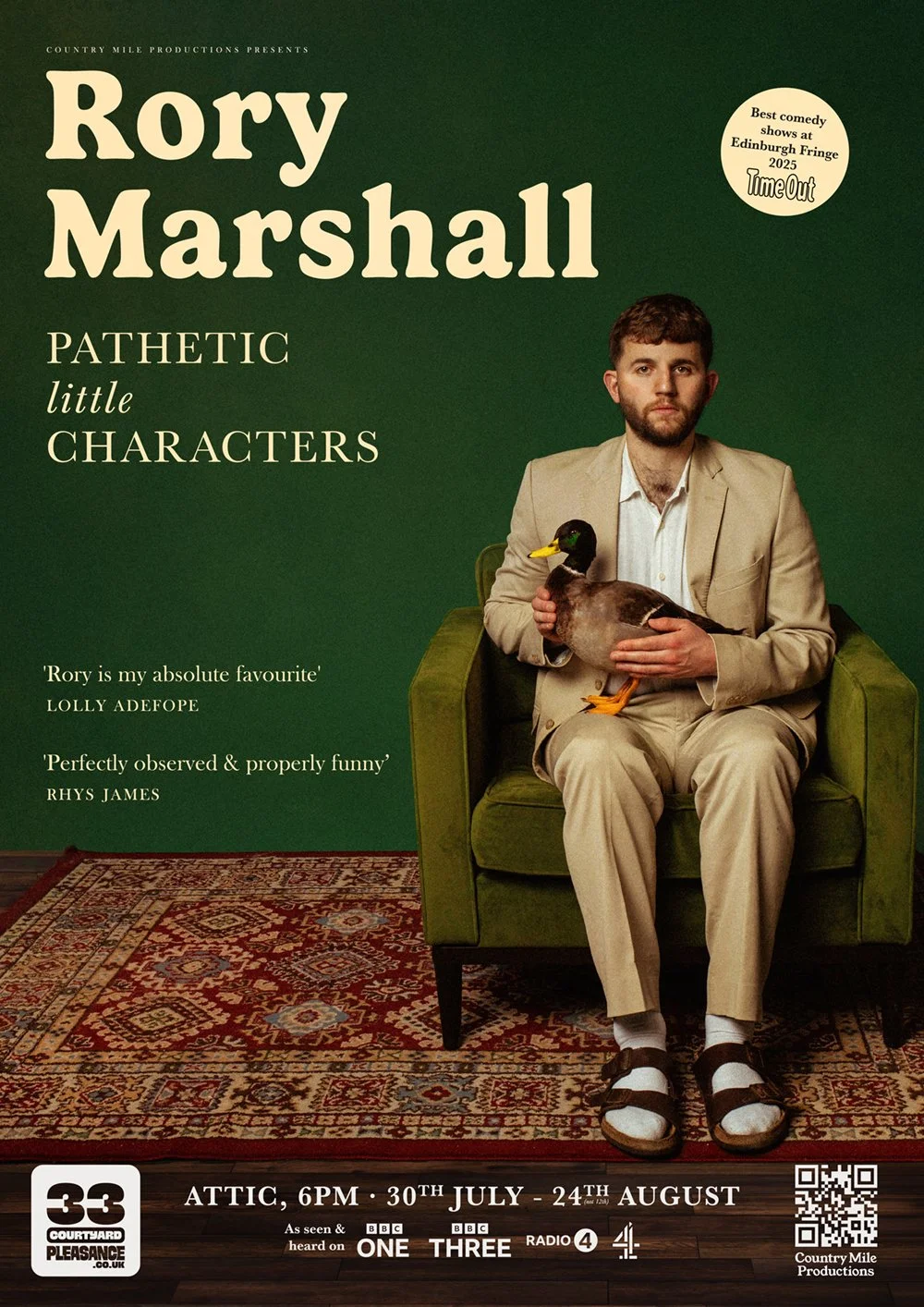 Poster for Rory Marshall show featuring a man in beige suit sitting on a green armchair holding a duck. Background is dark green with event details and quotes.