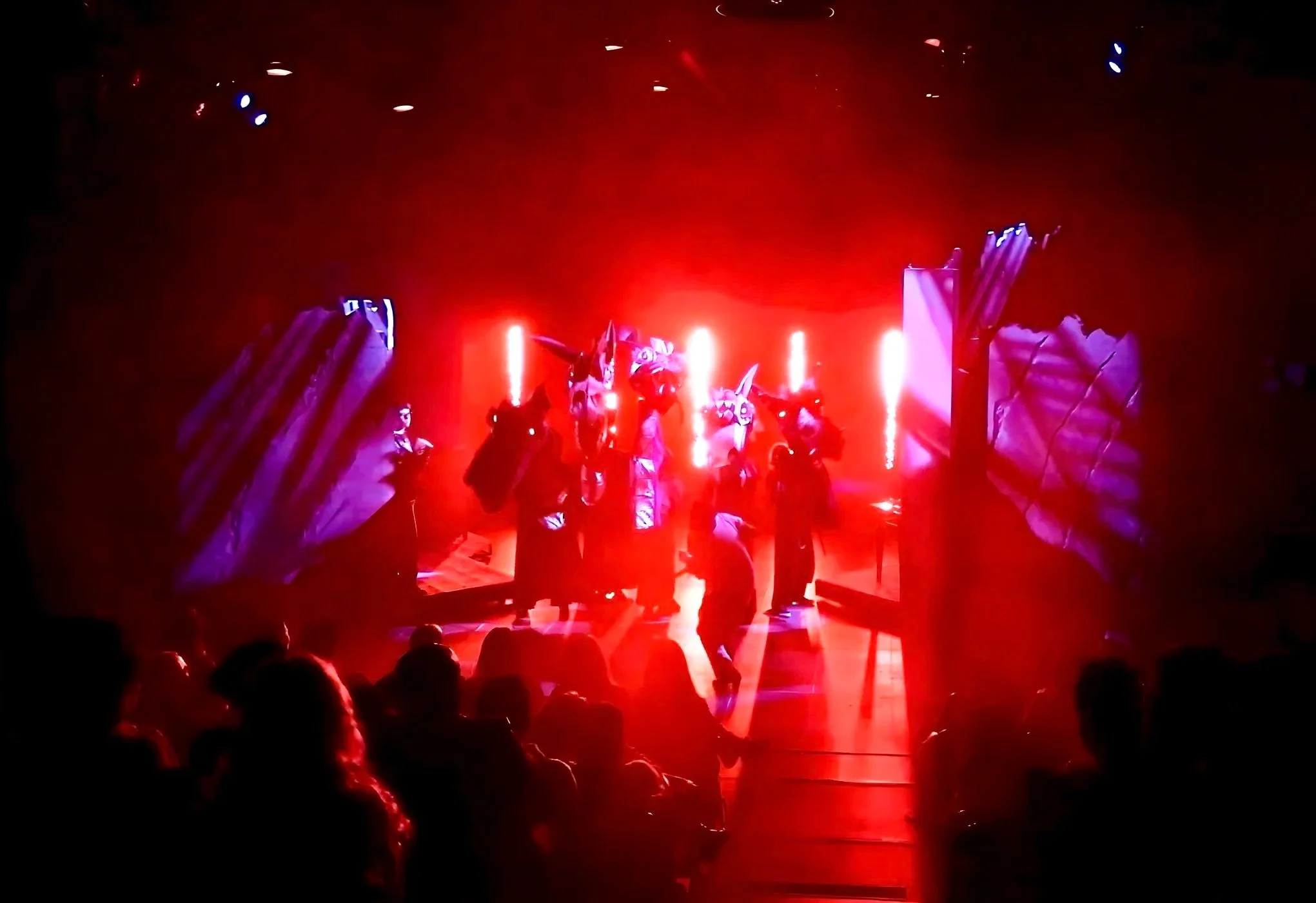 Tiamat fight: The lighting for the fight was bold and bright. I contrasted cool gobos with a brilliant red blinding light. Additionally, a soft top light allowed the action to be seen clearly.