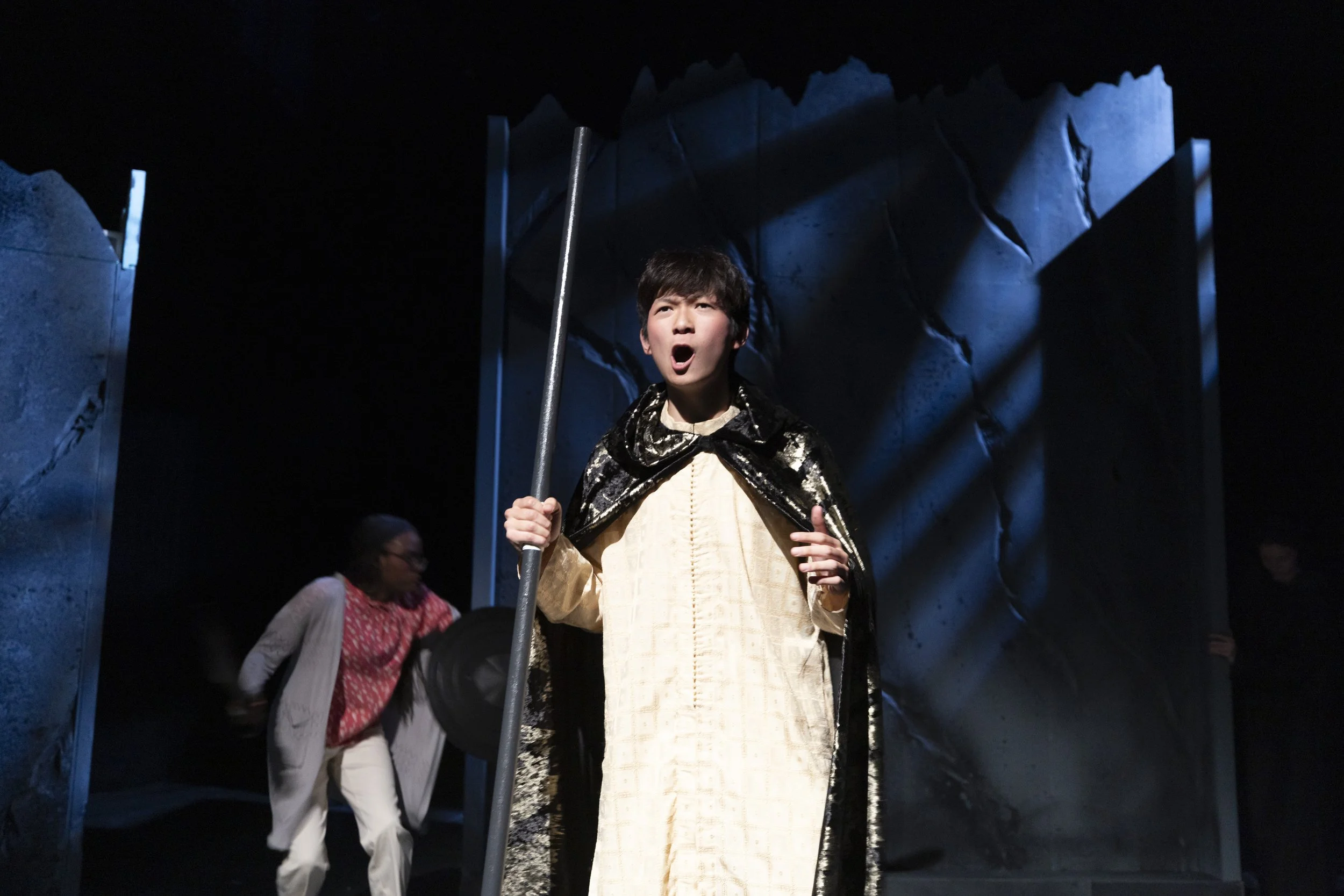 The Narrator: I lit the Narrator with cool front light and left the action in the background in blue gobos. high-contrast light and shadow from the surrounding scenery. The sharper angle helped separate him from the rest of the stage and gave the mom