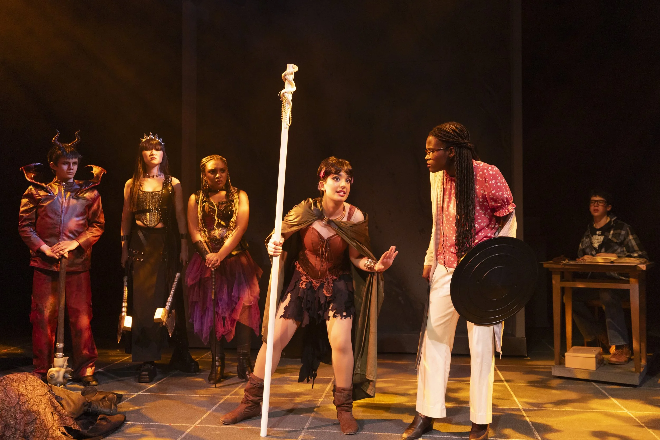 The standard D&D look: This was one of the main fantasy looks for the show. I used warm textured light across the floor paired with box booms. One side of the stage was a pink (R35) and the other was a lavender (R55). This created a world that felt f