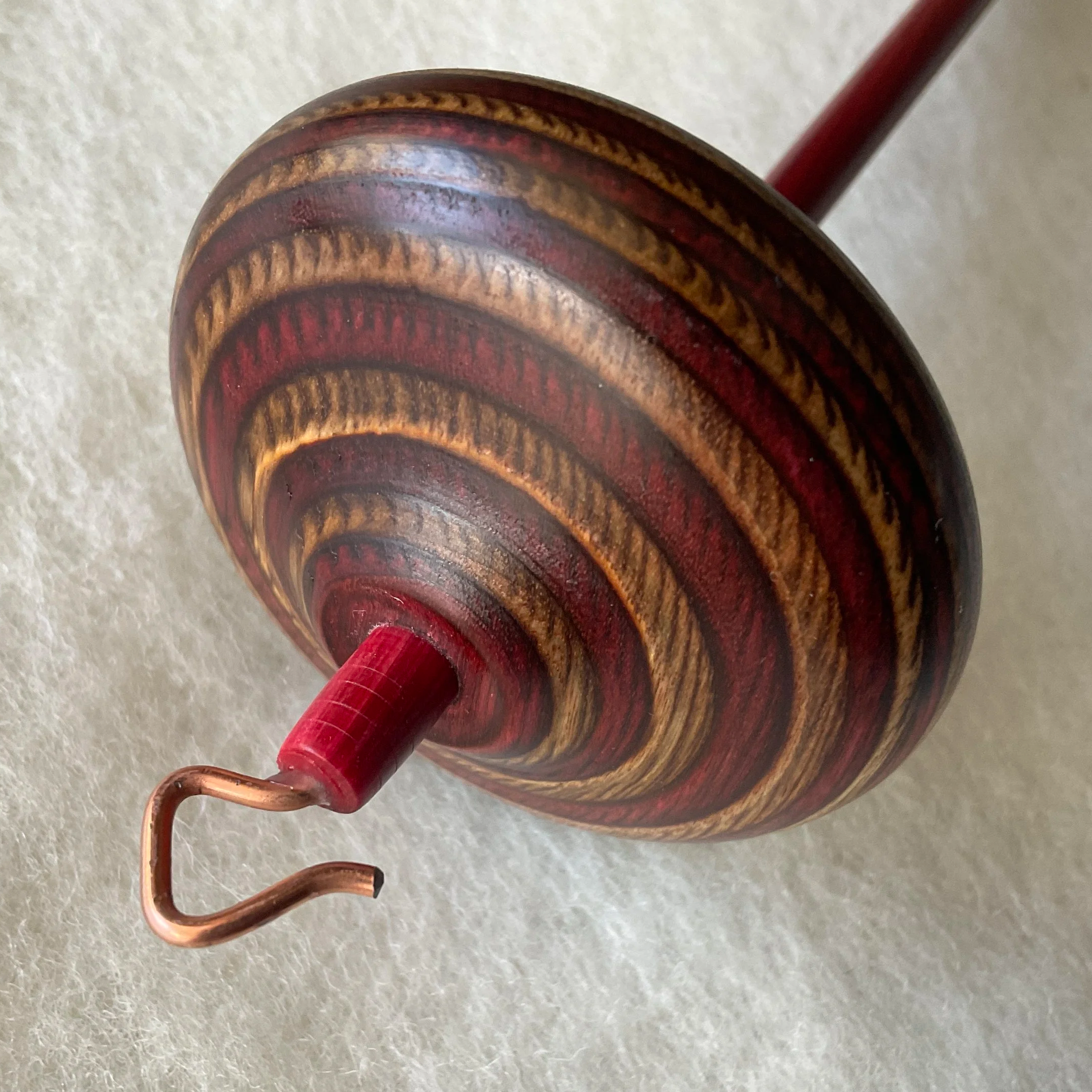 Cinnamon whorl, red shaft Mini Swan™ hand spindle