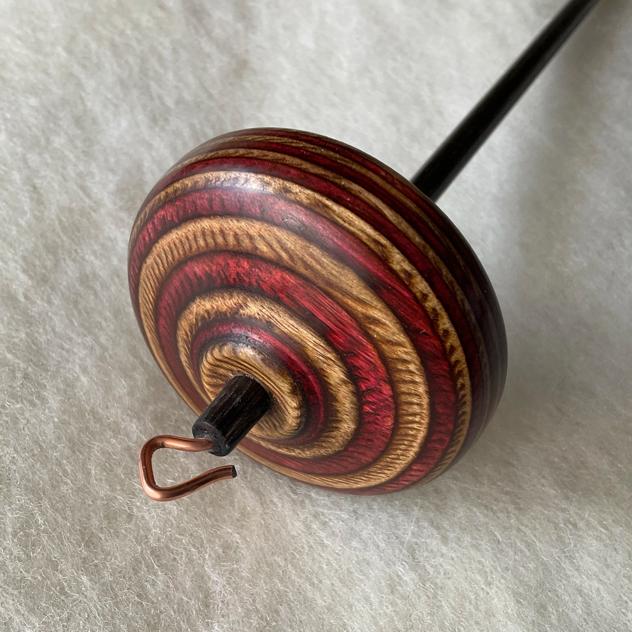 Cinnamon whorl, charcoal shaft Mini Swan™ hand spindle