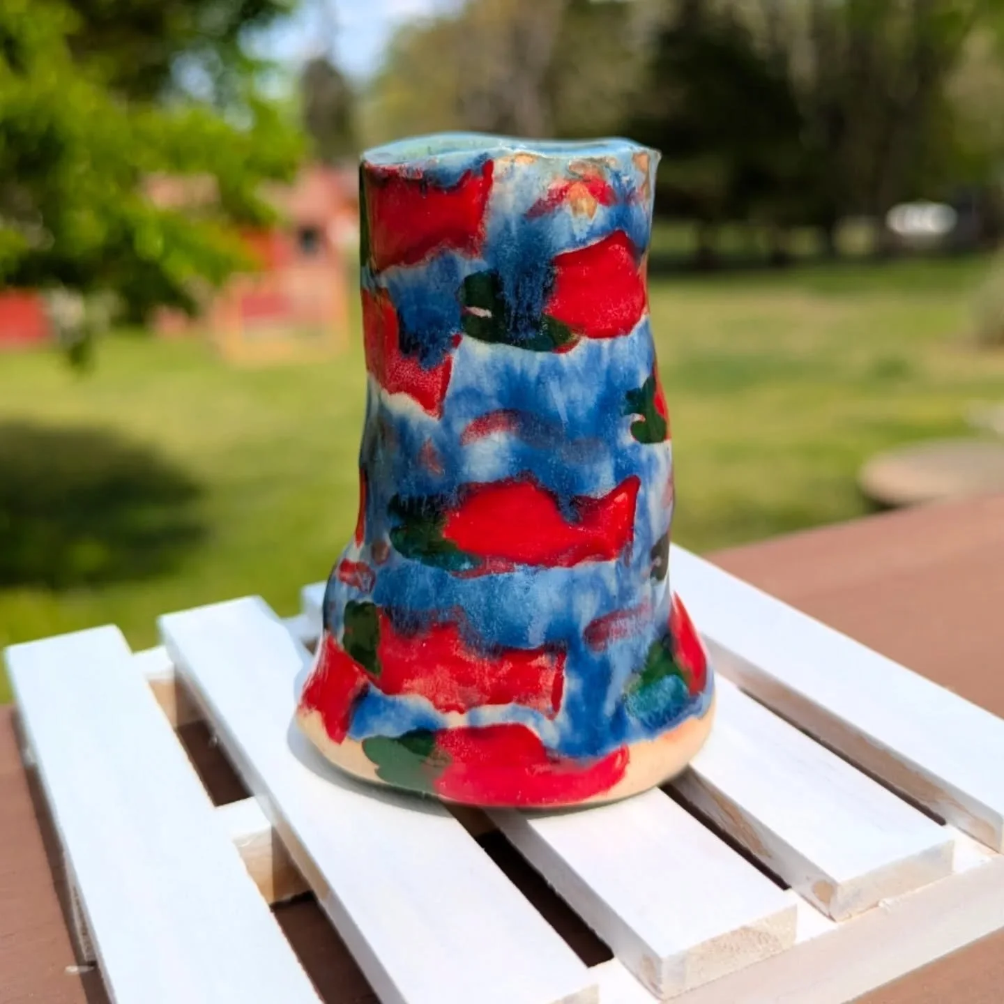 In honor of @katmainpp fat bears, I made a candle stick holder celebrating the salmon run in Alaska. 
I'm really happy with the colors and how the blue glaze pattern turned out. I wanted it to look like a busy piece with the salmon swimming up stream