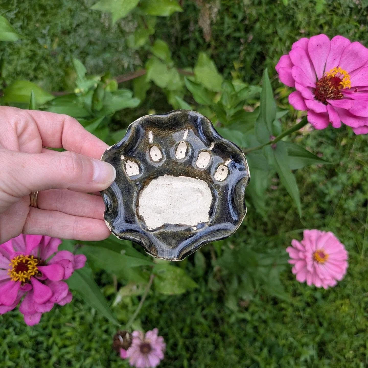 A bear paw print trinket dish! 
The glaze on this one turned out beautifully. What tracks should I make in the future? 
...
#ceramics #handmade #blackbearart #beartracks