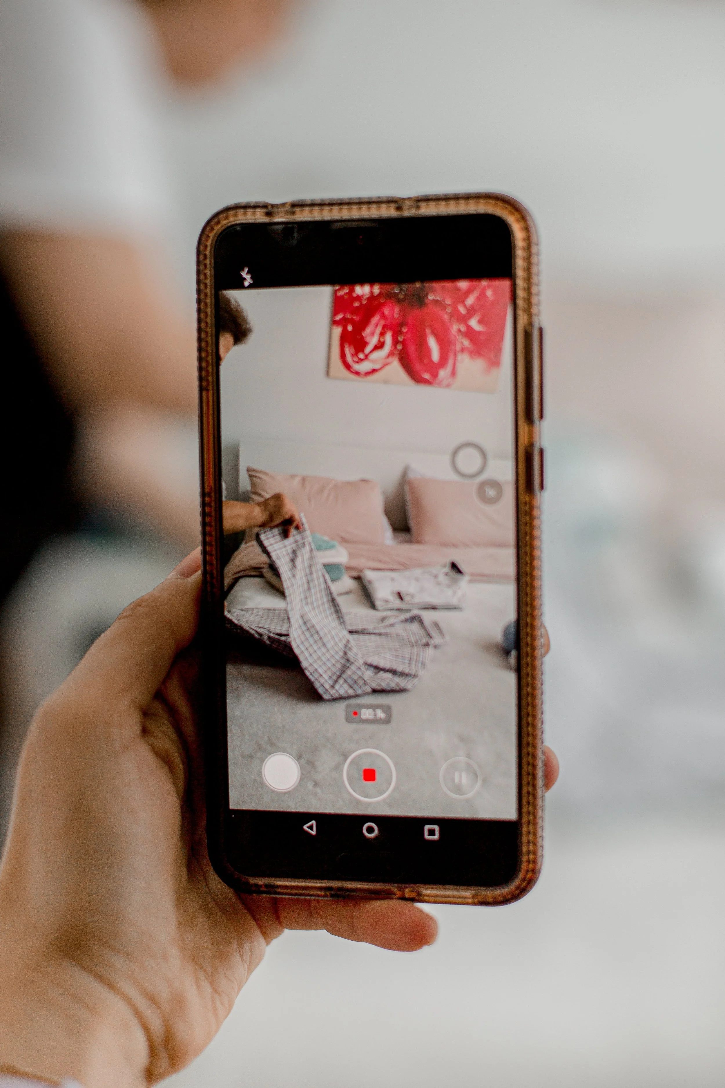 mobile-phone-recording-person-doing-laundry.jpg