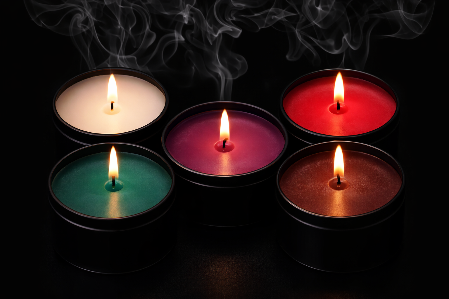 Five lit scented candles in black containers arranged in a circle on a dark surface, with smoke rising from some of the flames.