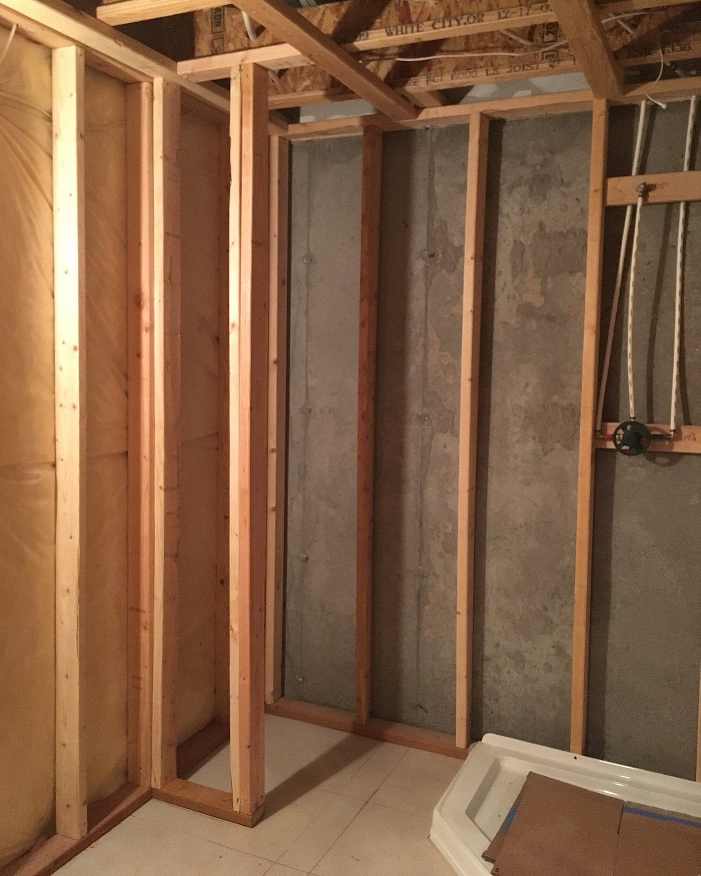 Before, During, &amp; After &bull; of a basement bathroom we finished. ✨ We added an accent wall + some custom shelves for extra storage.  #bskeltonconstruction #generalcontractor #basementremodel #stgeorgeconstruction