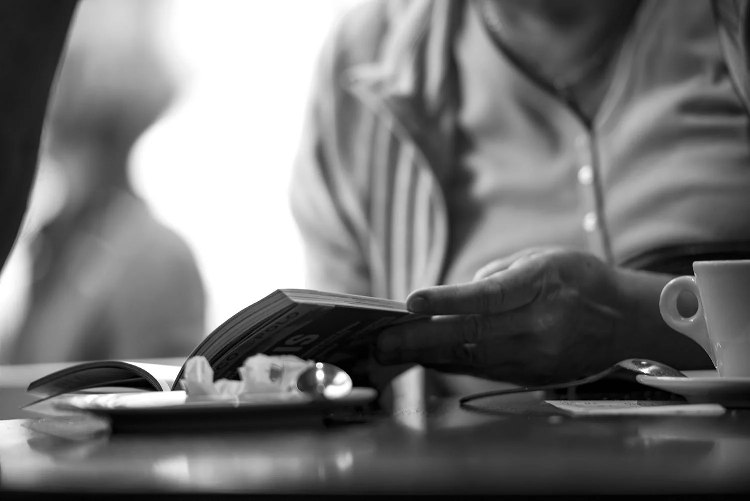 A quiet moment of reading and coffee inside the café.
Paris