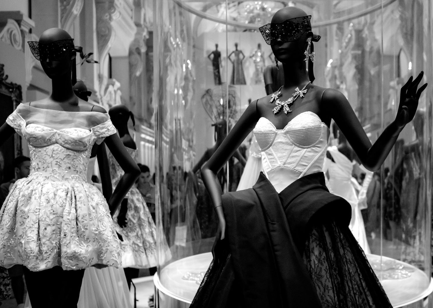 Displayed in signature Dior style, the mannequin appears almost lifelike, presenting couture with the poise of a runway model.