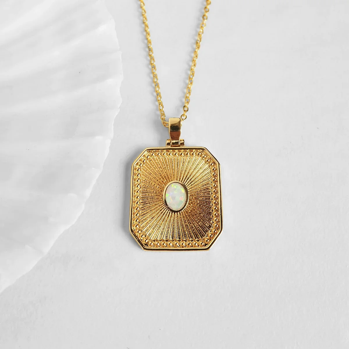 opal-sunburst-gold-necklace-1-2.webp
