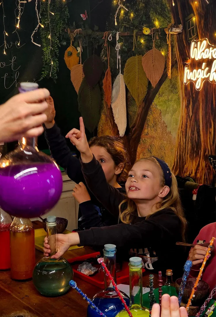 Children pouring a magic potion together