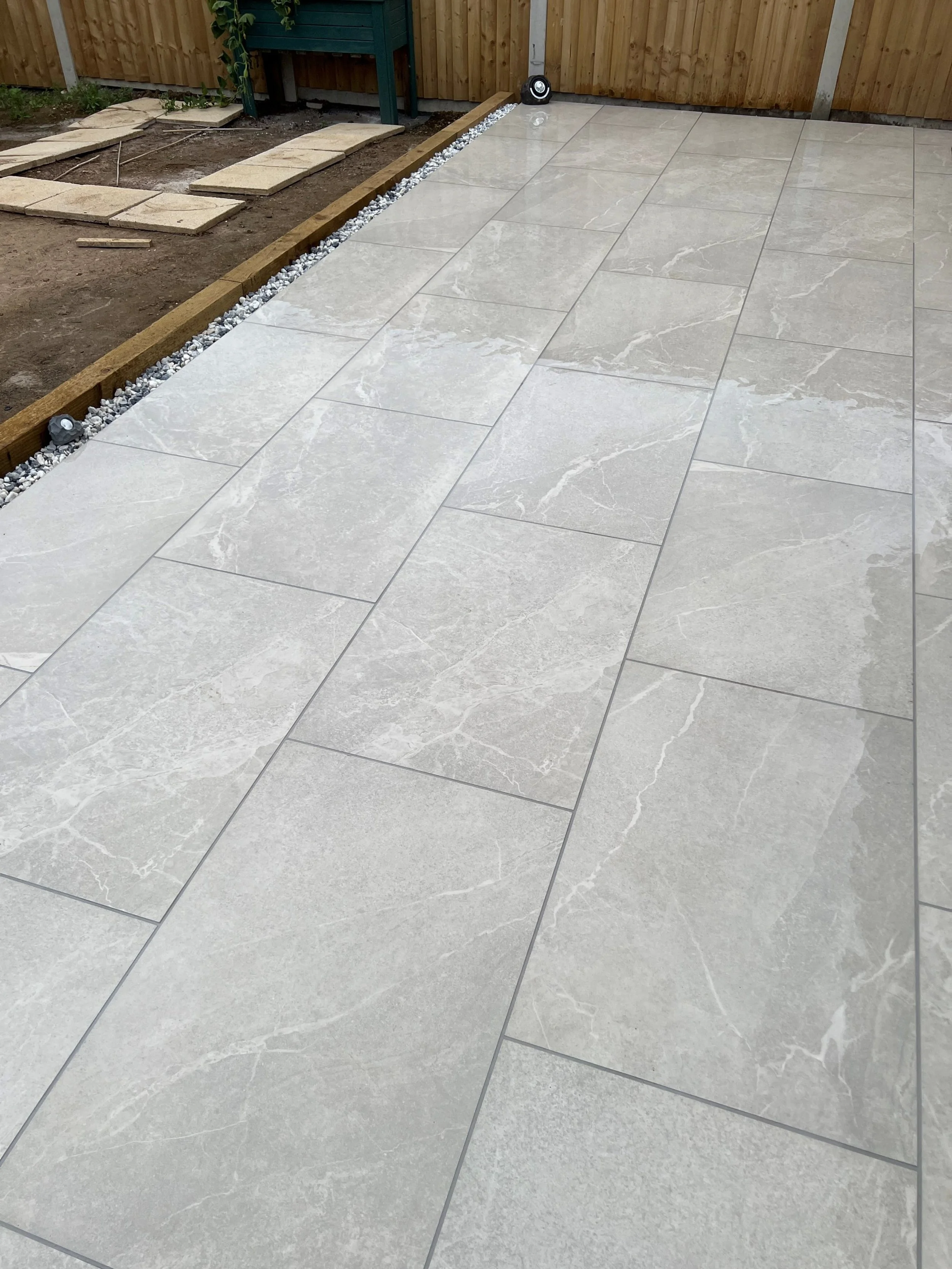 900 x 600 Porcelain tiles laid in stretcher bond for a patio