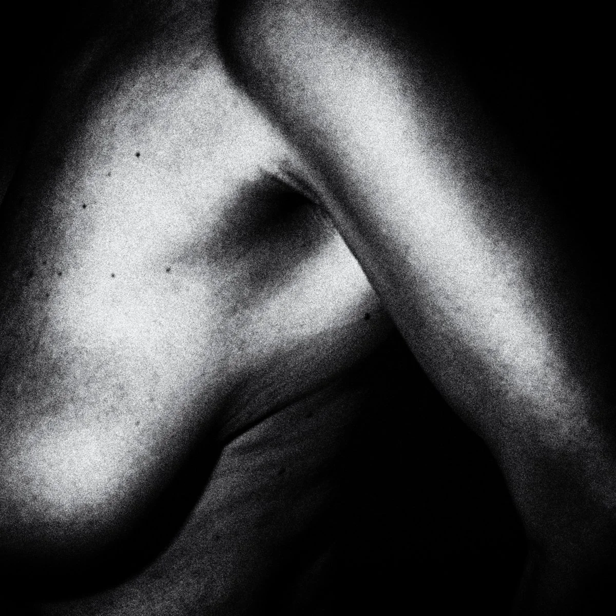 Abstract photography, upper hand and shoulder, Black and White.