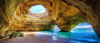 This iconic sea cave in Portugal's Algarve region is world-famous for its massive domed interior and a striking circular opening in the ceiling a must see experience.