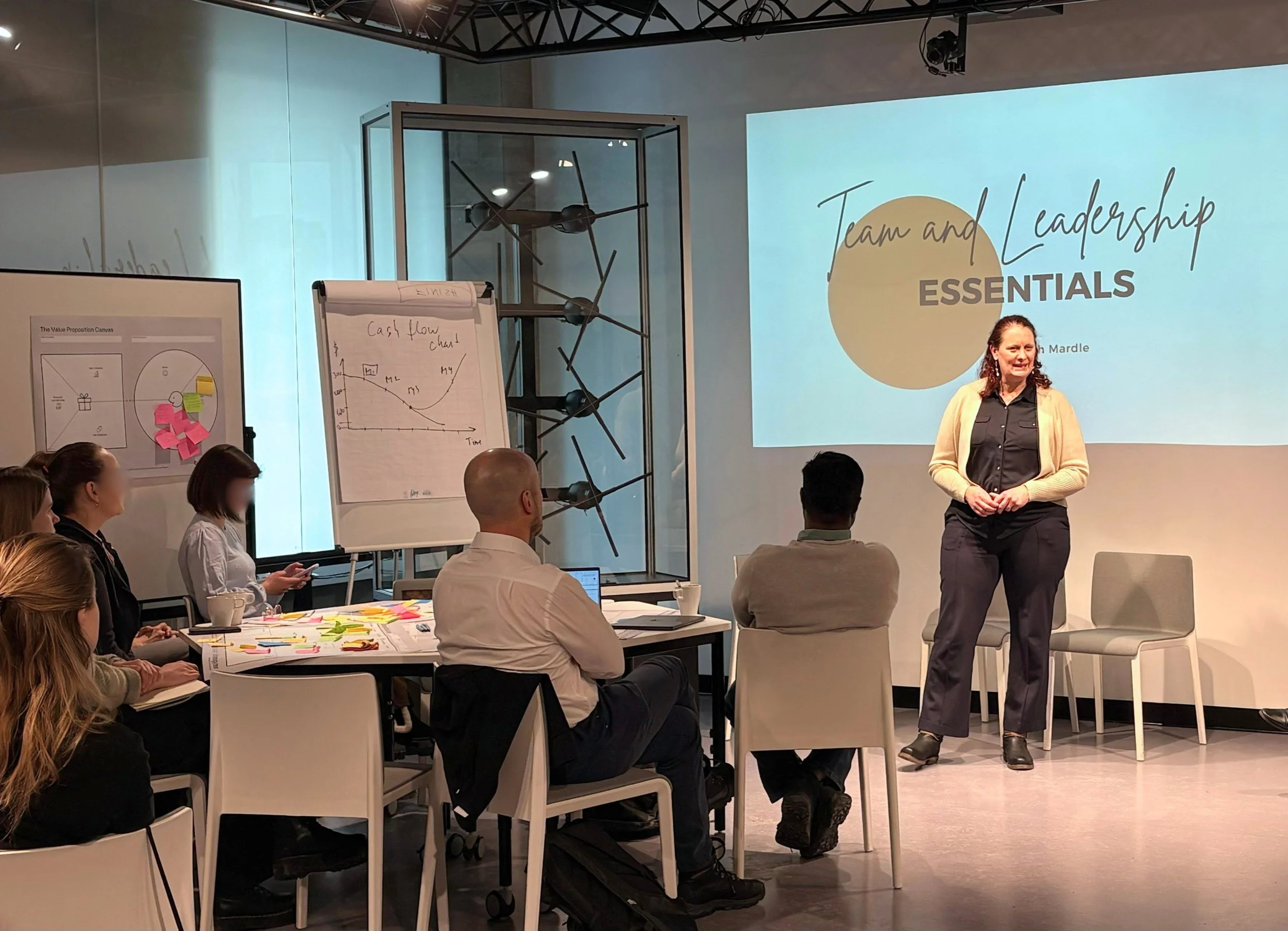 Sarah Mardle, Founder of Alma, presenting about leadership in front of an audience