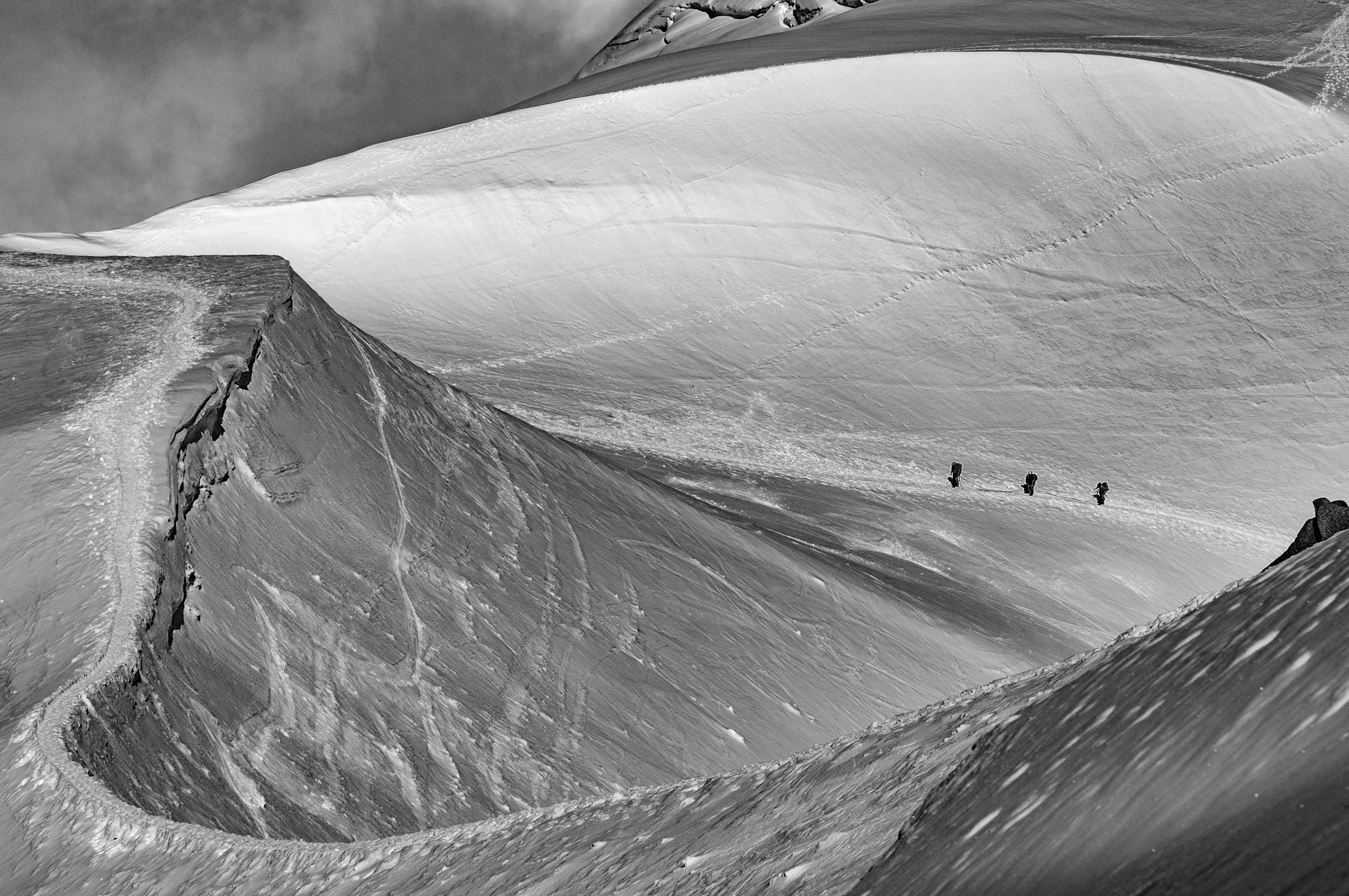 Mountain climbers working together symbolizing perseverance and support
