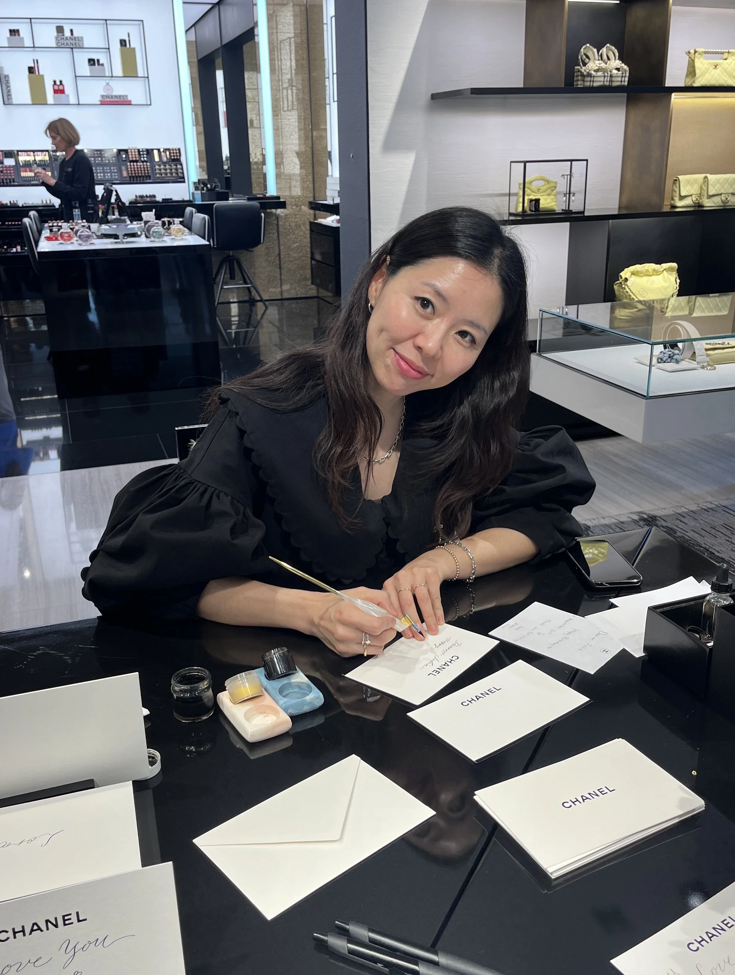Los Angeles calligrapher Hanseul Kim providing live event calligraphy and engraving services for luxury brand activations.