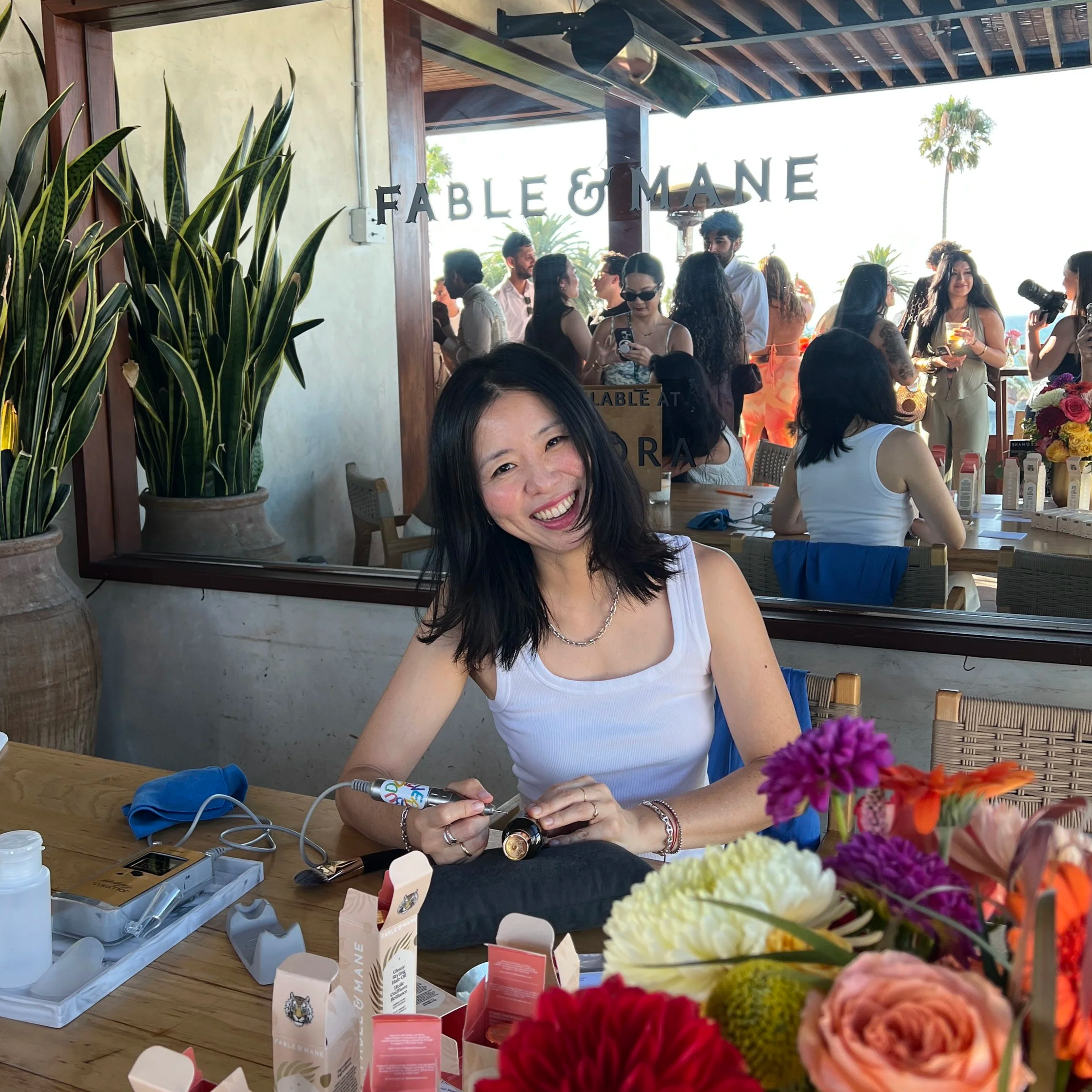 Los Angeles calligrapher Hanseul Kim creating personalized luxury brand experiences through live event calligraphy, on-site engraving, and custom lettering.