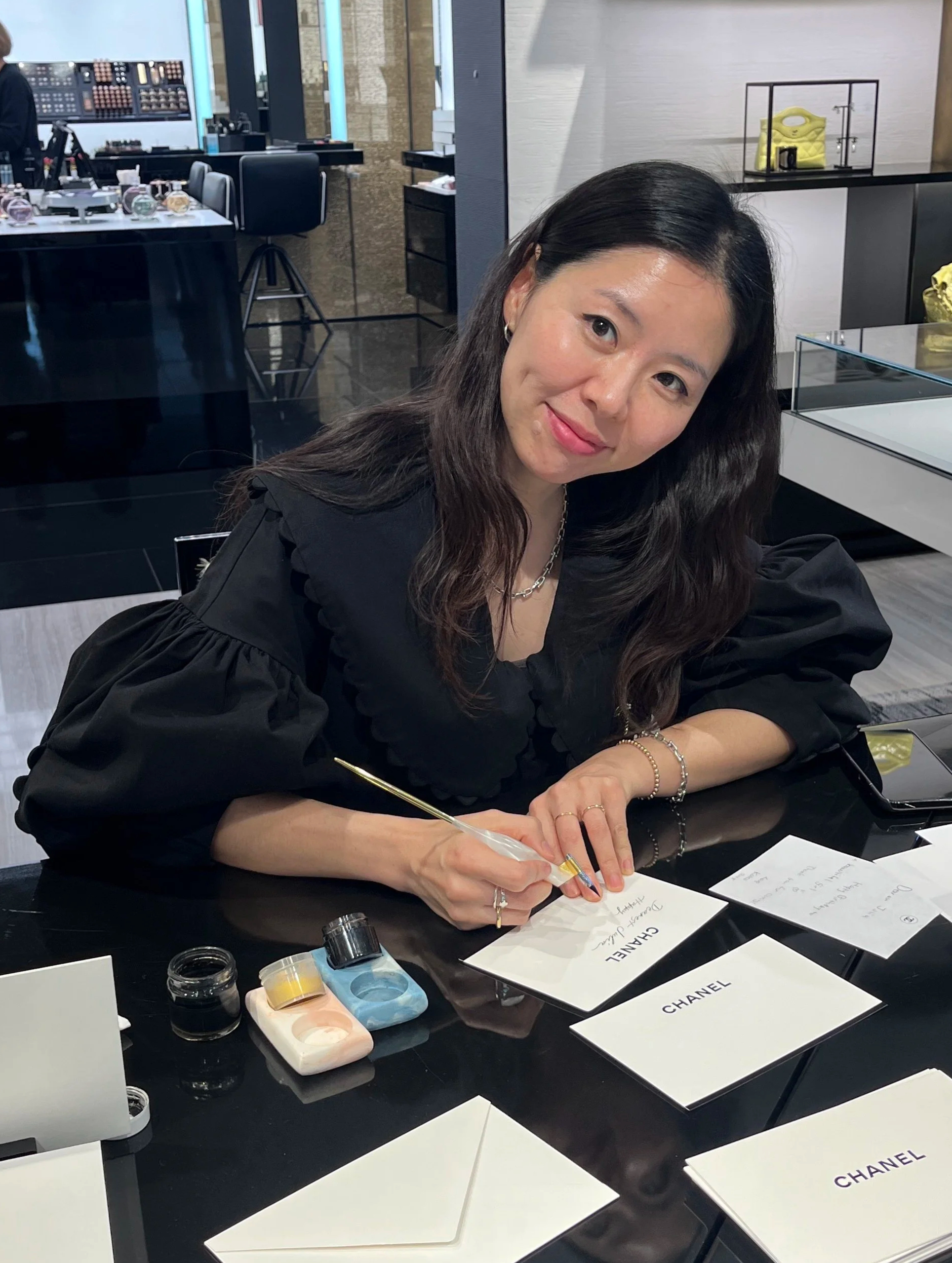 Portrait of Los Angeles calligrapher and engraver Hanseul Kim, founder of Jollyseul Calligraphy, specializing in live event calligraphy, luxury brand activations, and on-site engraving services.