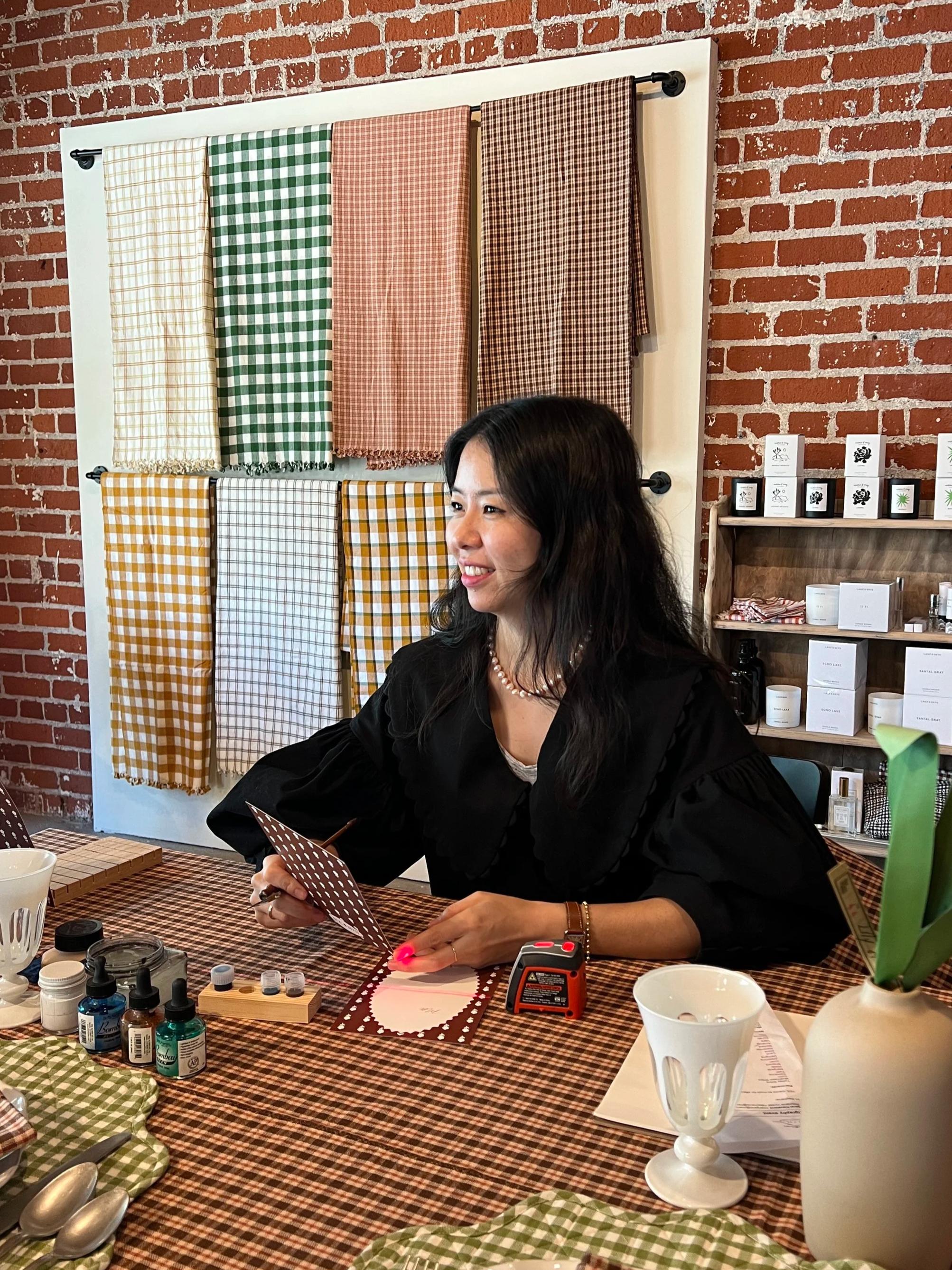 Hanseul Kim of Jollyseul Calligraphy creating live event calligraphy and on-site engraving experiences for luxury brand activations, retail events, and weddings in Los Angeles.
