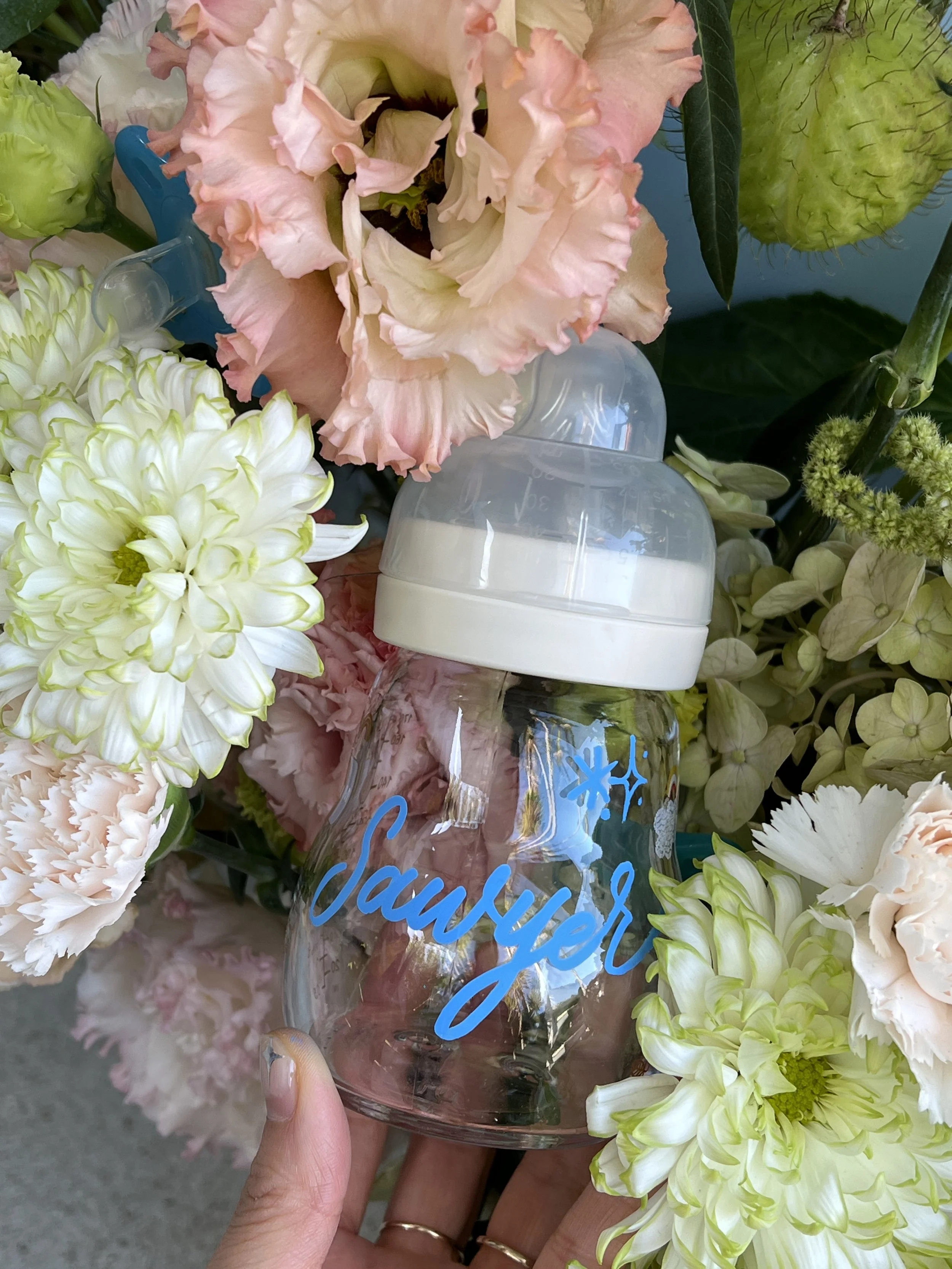 live glass bottle calligraphy during on-site event for mom and baby brand in Beverly Hills, Los Angeles