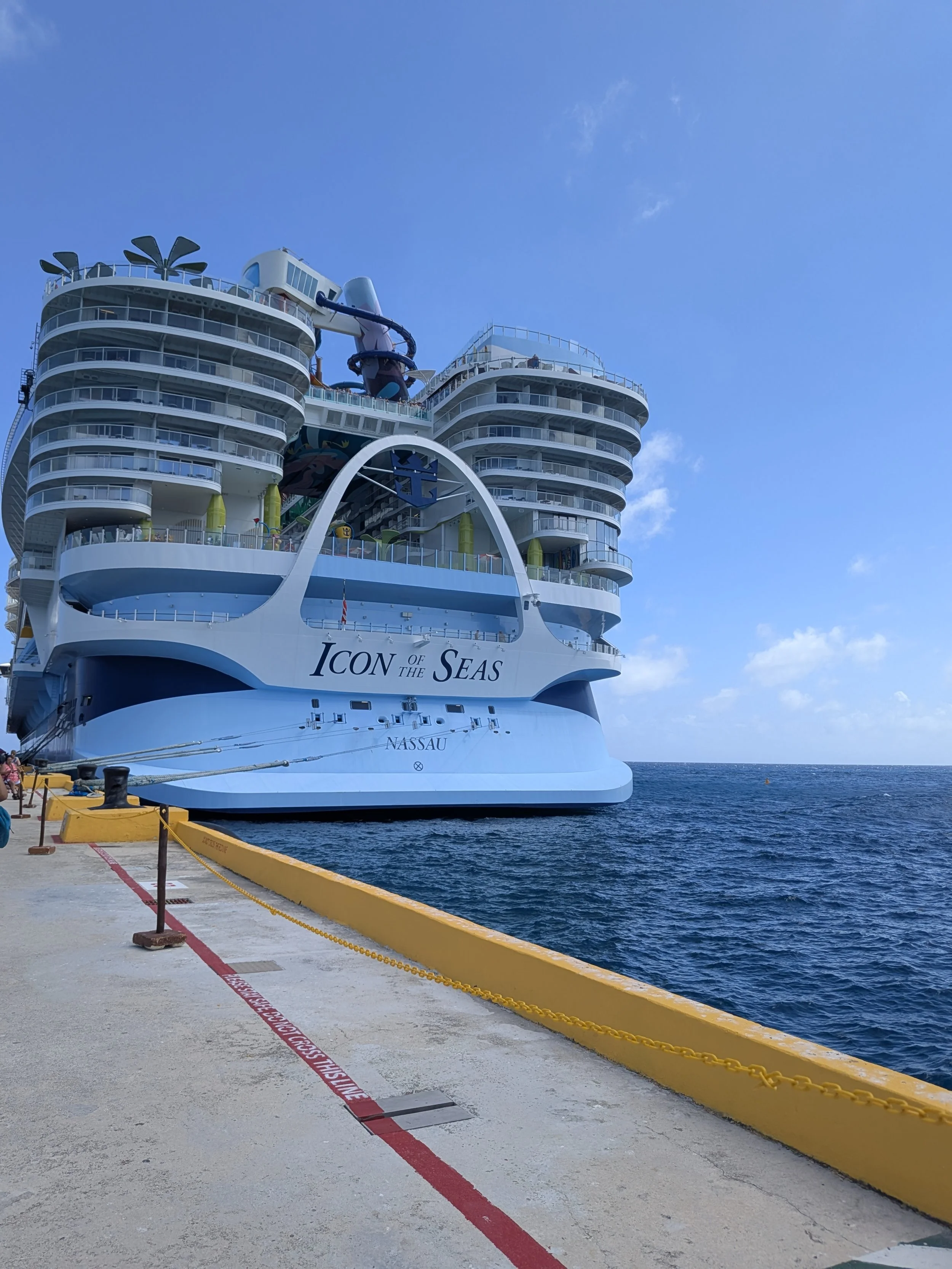 Stern of Royal Caribbean's Icon of the Seas, home to Star Class suites, docked in port