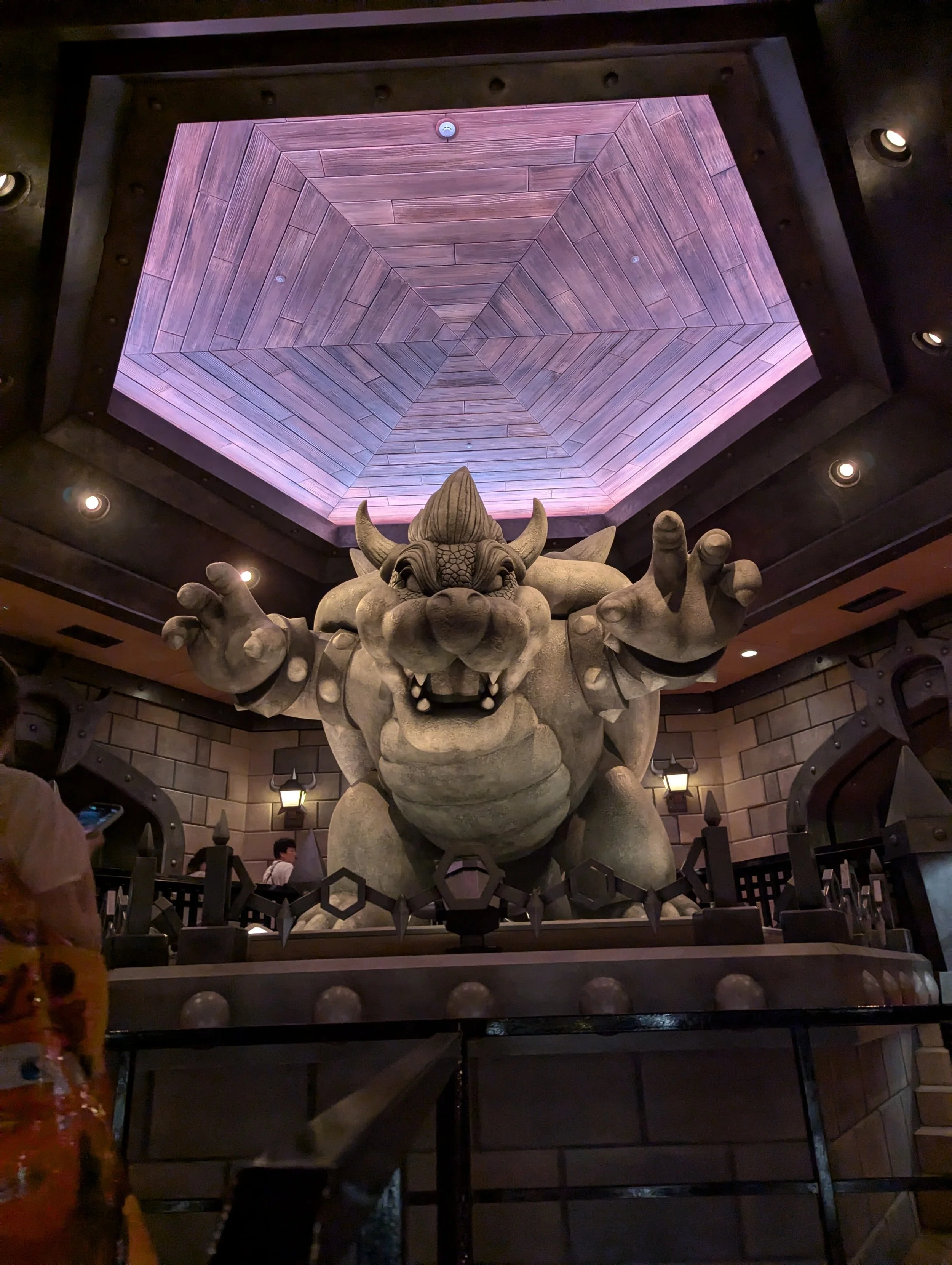 Giant Bowser statue inside Bowser's Castle, the queue for Mario Kart: Koopa's Challenge at Super Nintendo World Japan