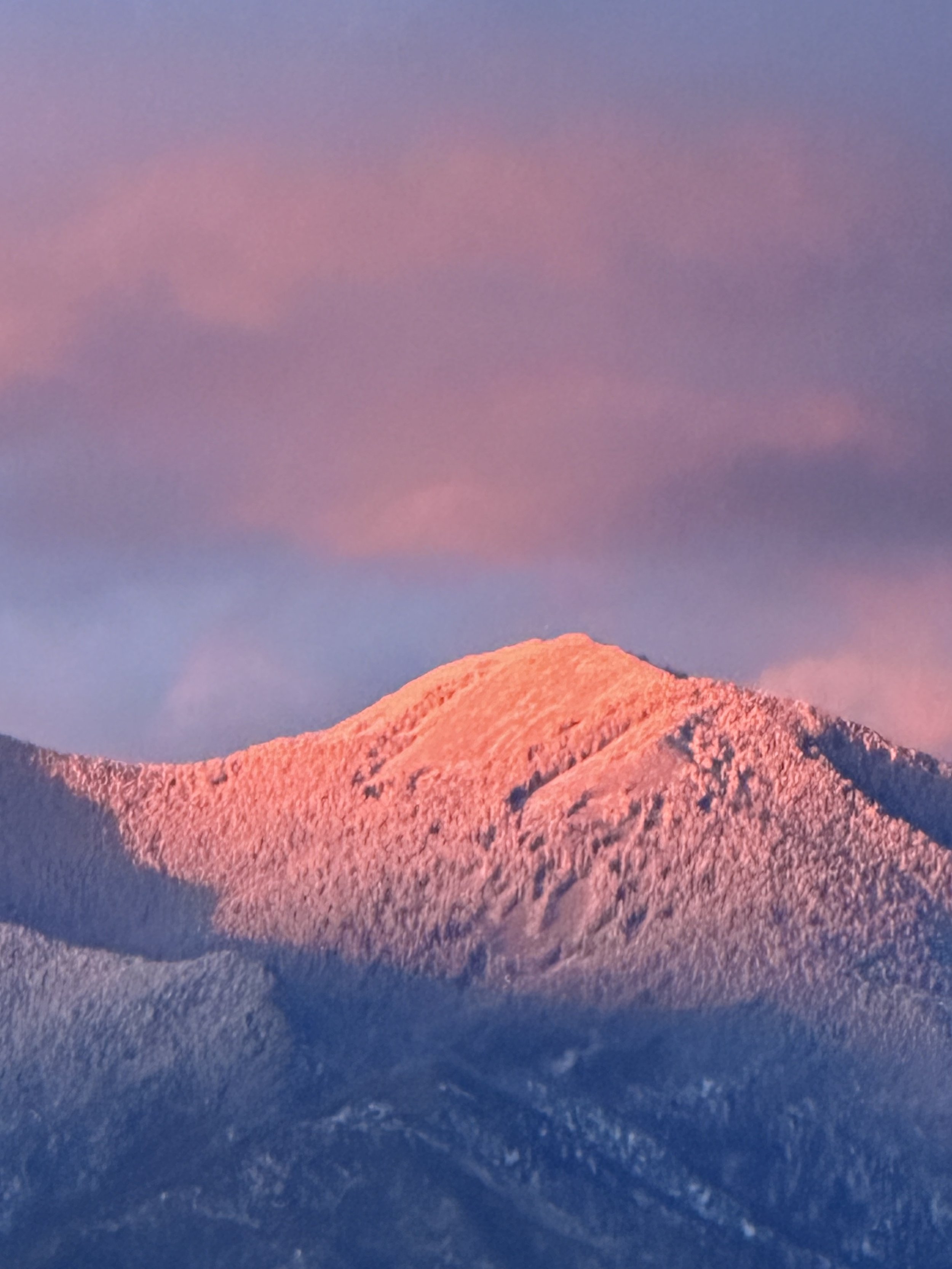Alpen glow on Pueblo Mountain, Taos, at sunset.