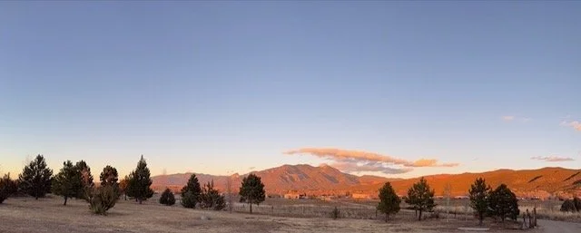 Official site image from Harmony Taos Regenerative Farm showing retreat setting, program materials, or guest spaces.