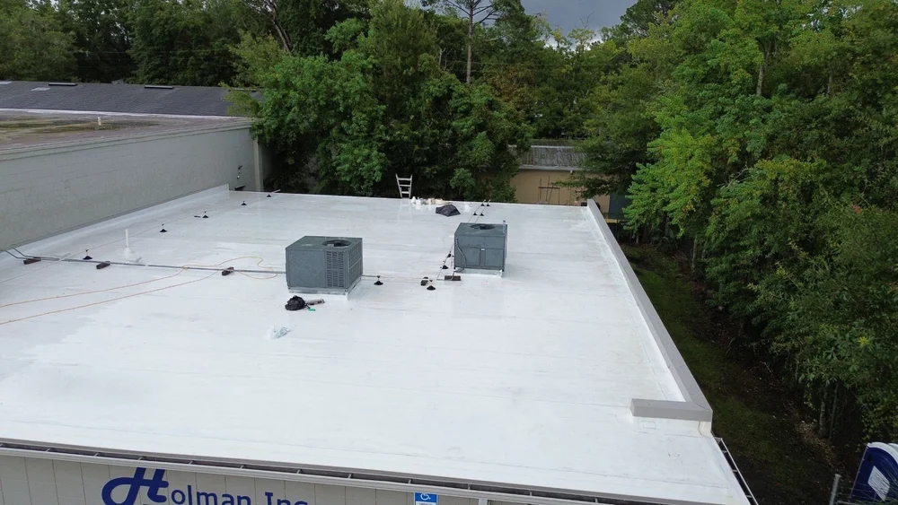 Low-slope commercial roof with HVAC units in Jacksonville, FL