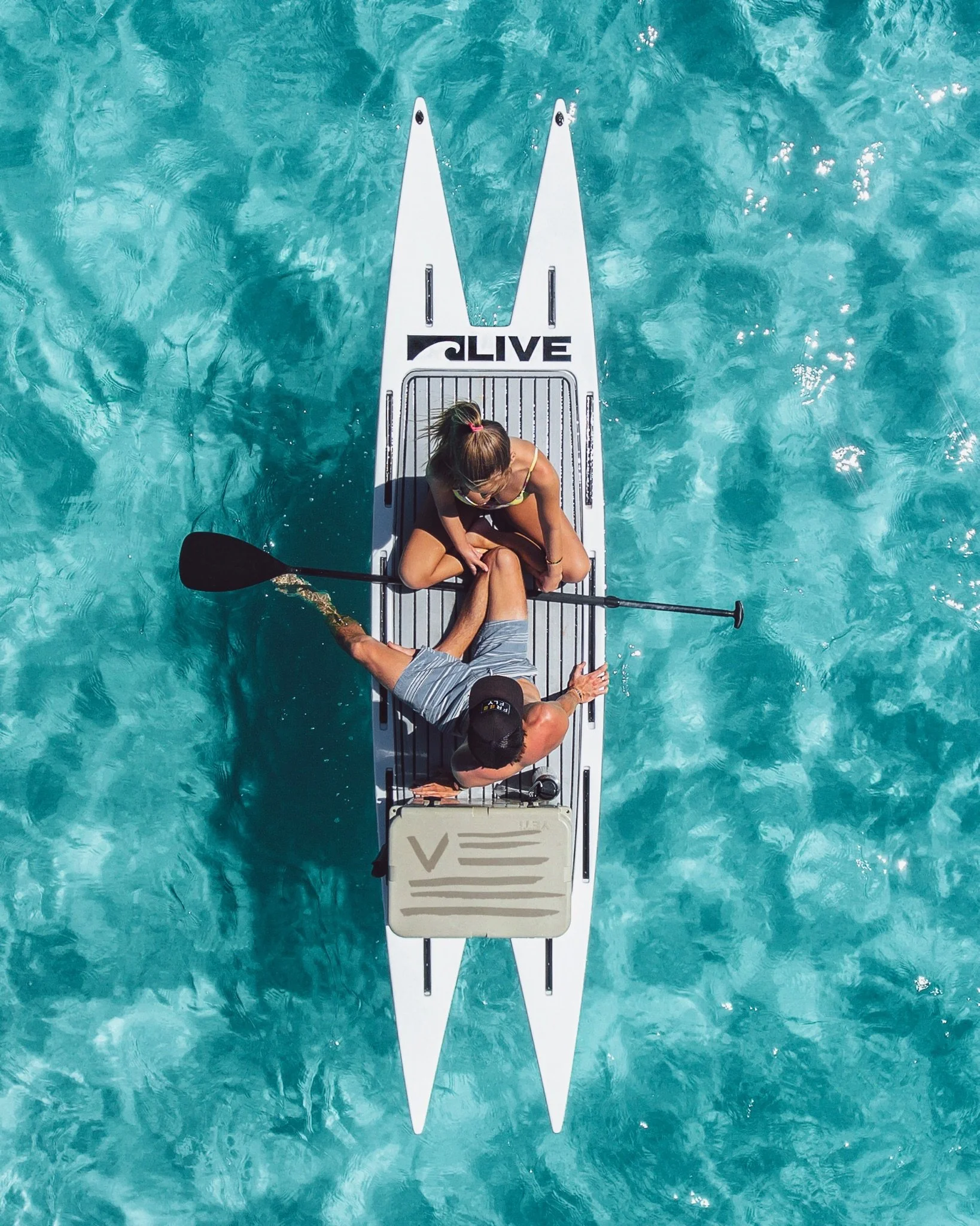 Action shot of the L2 Fish with two people sitting on it.