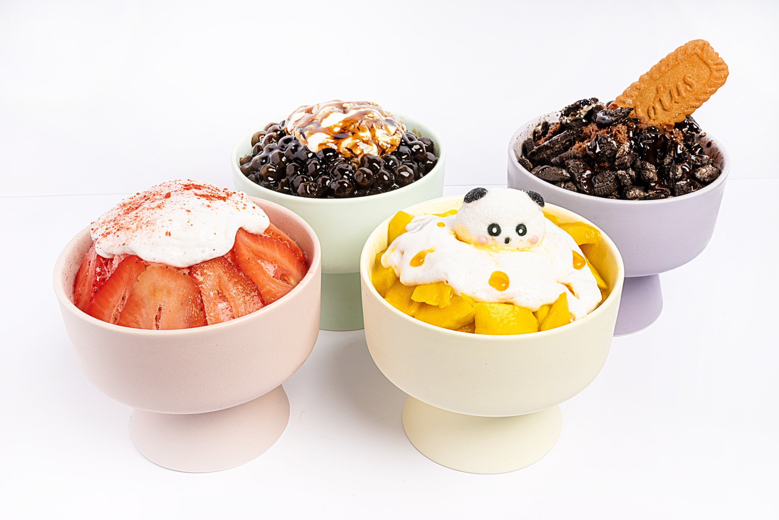 4 bingsu flavors next to each other. Strawberry, Mango, Oreo, and Brown Sugar Boba Flavors