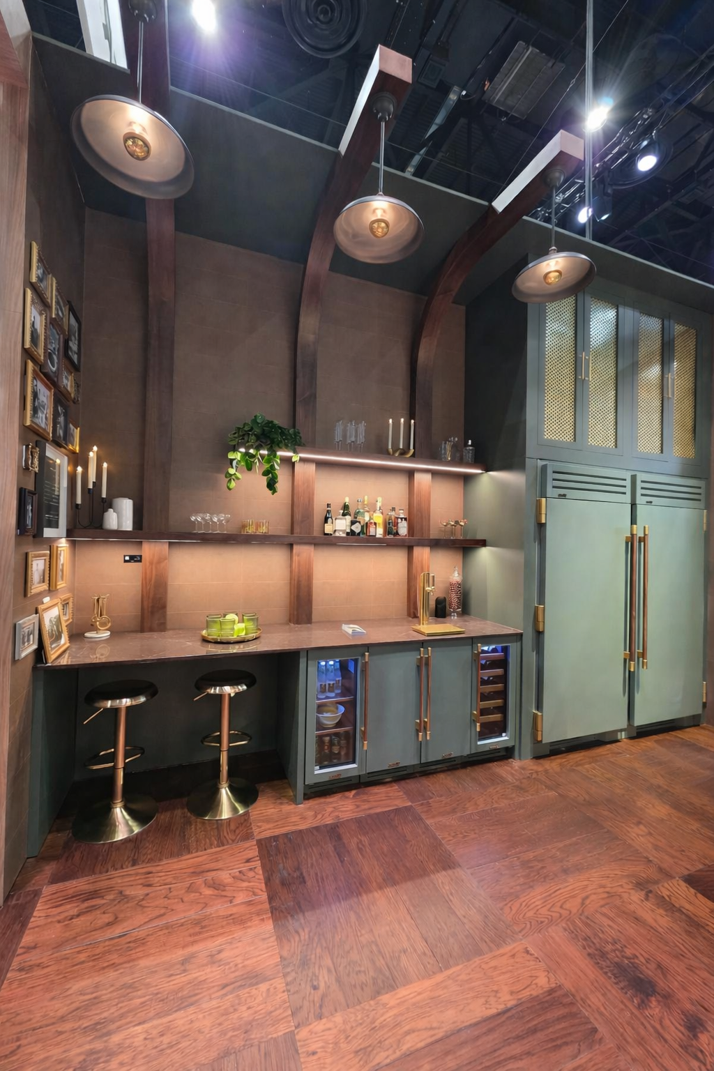 High-end hangar home bar design with green cabinetry, brass hardware, wood beams, and built-in beverage refrigeration.