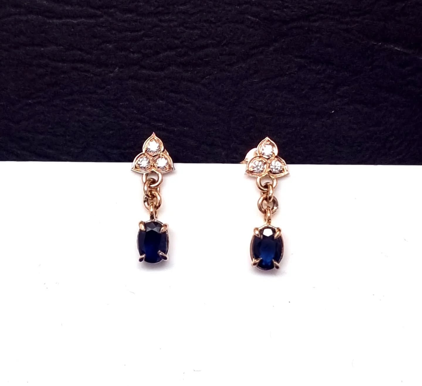 Custom elegance in every detail.

These sapphire and diamond drop studs were designed as a custom request &ndash; timeless navy-blue ovals suspended from a delicate trio of sparkling diamonds. Set in warm rose gold, they&rsquo;re the perfect blend of
