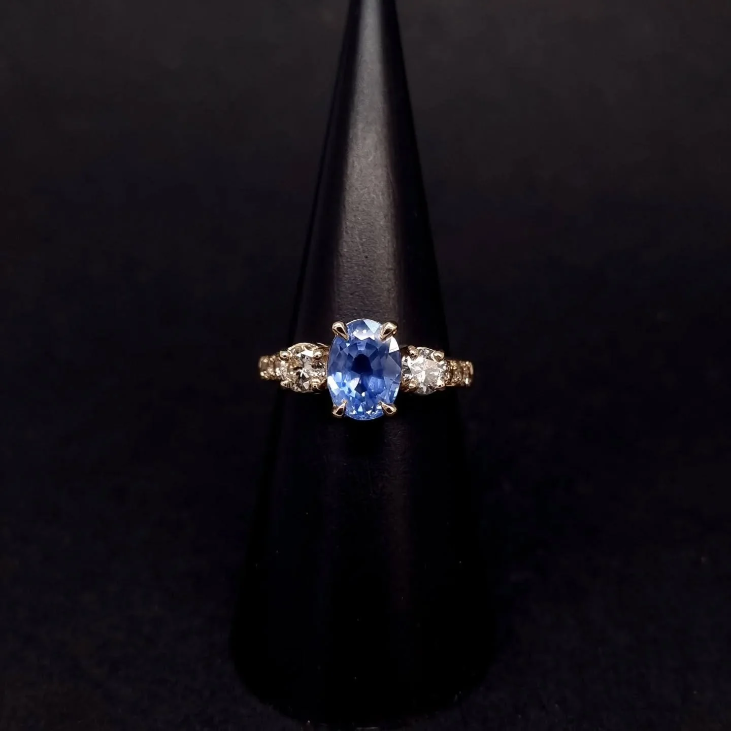 A new chapter, built from memories.
This engagement ring was lovingly remade using the client’s own gold and diamonds — reworked to carry their history forward.
We supplied a stunning 2.44ct cornflower blue sapphire as the centrepiece, se