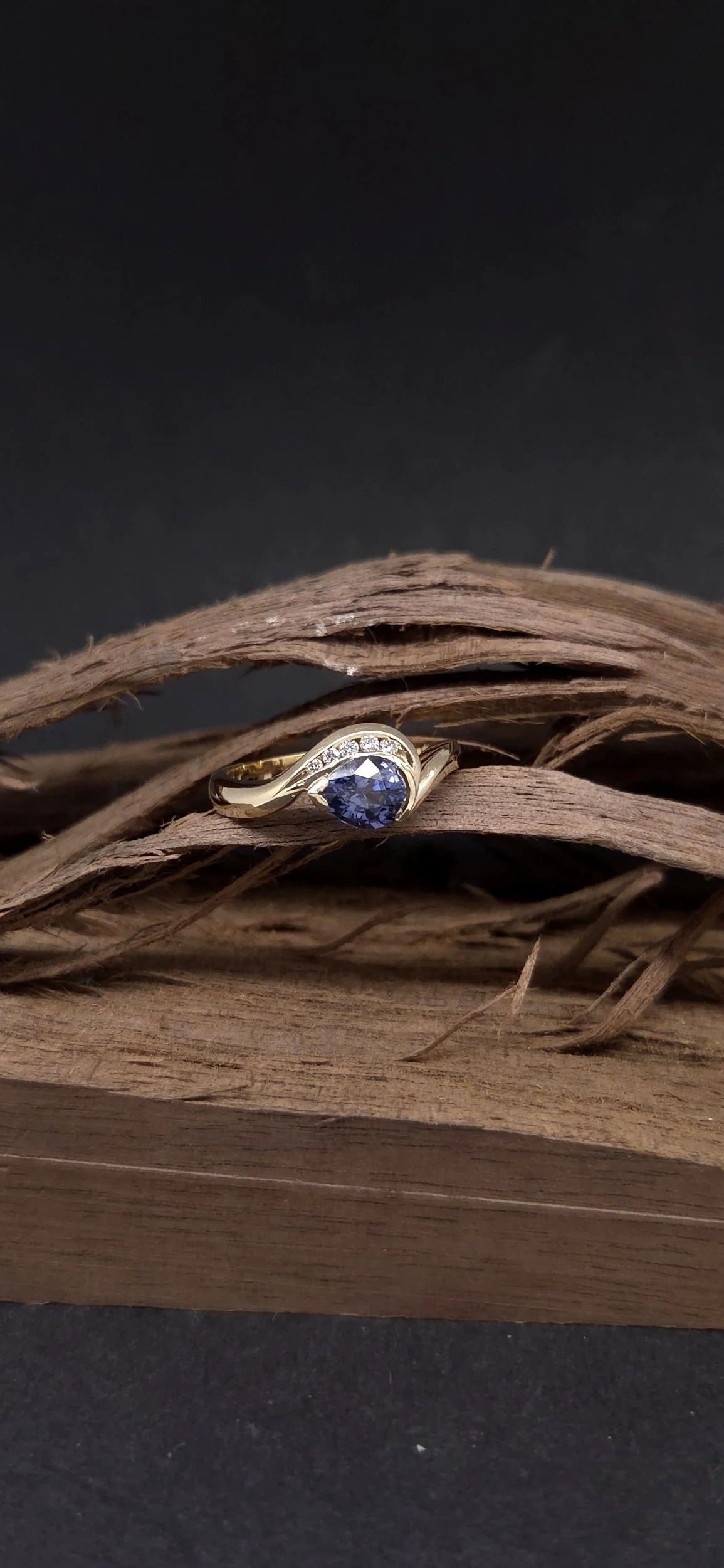 blue grey Spinel and twist style in yellow gold with diamonds

