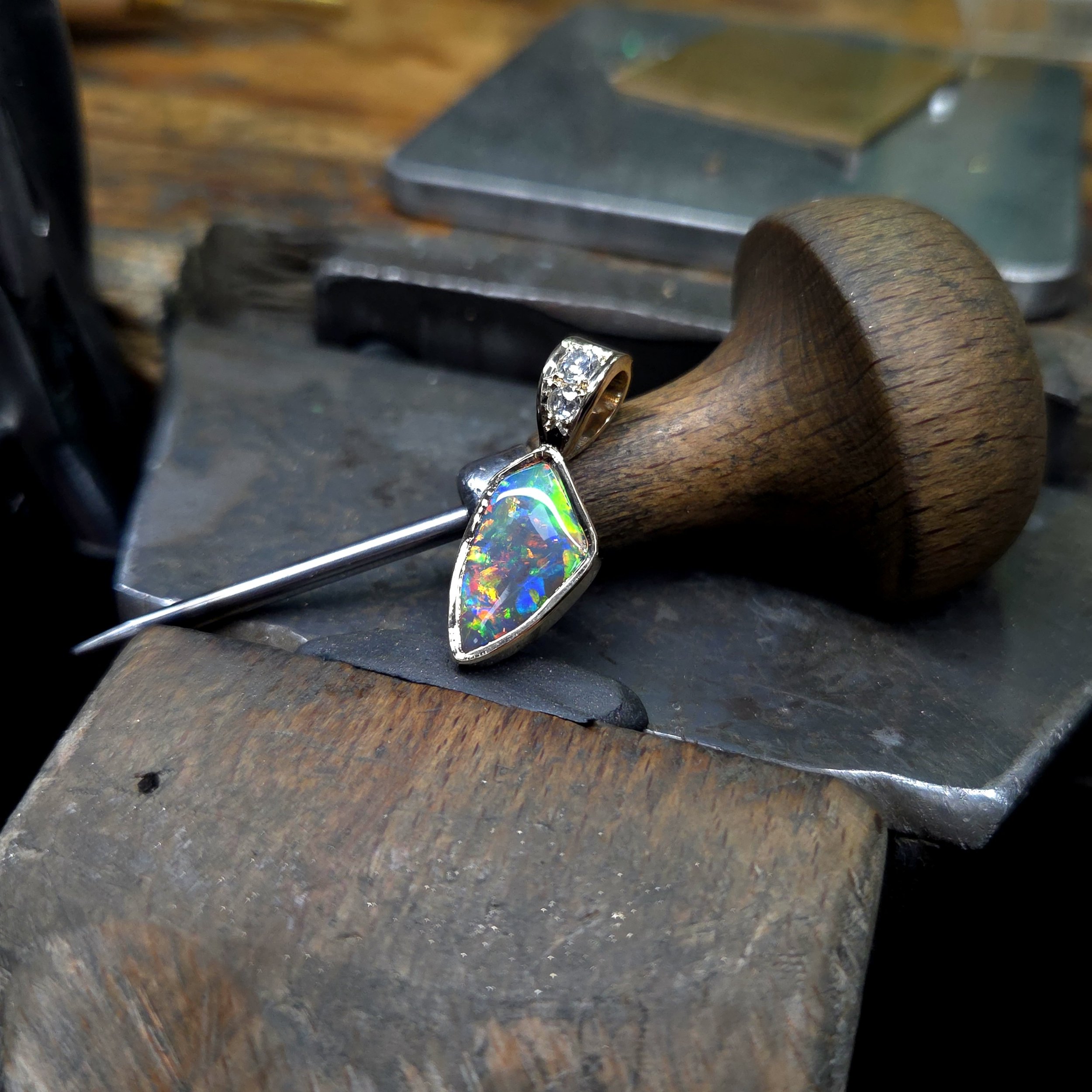 Opal and diamond pendant in gold